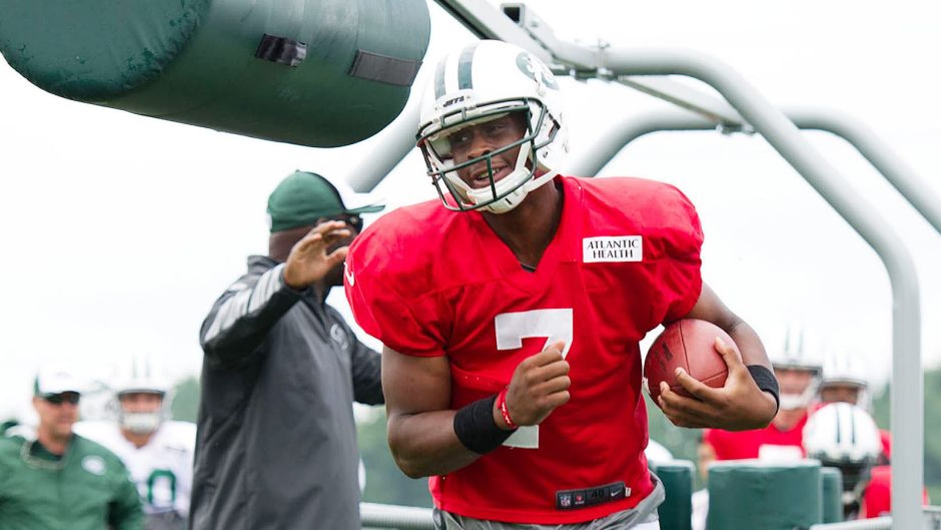 Aug 4, 2014; Cortland, NY, USA; New York Jets quarterback Geno Smith (7) runs with the ball during drills at training camp at SUNY Cortland. Mandatory Credit: Rich Barnes-USA TODAY Sports