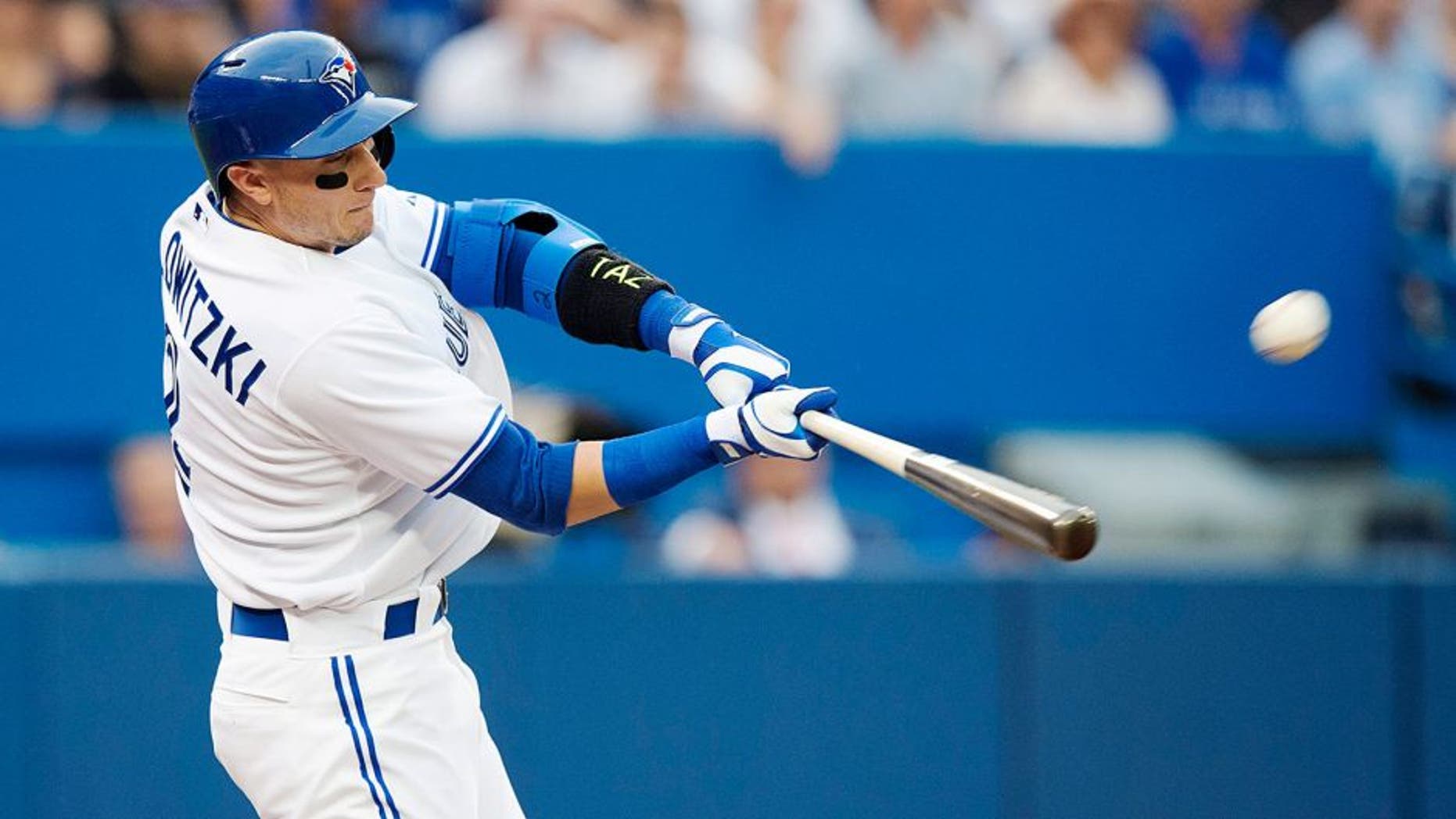 Toronto Blue Jays' Troy Tulowitzki hits a two-run home run during the third inning of a baseball game against the Philadelphia Phillies, Wednesday, July 29, 2015, in Toronto. (Darren Calabrese/The Canadian Press via AP) MANDATORY CREDIT