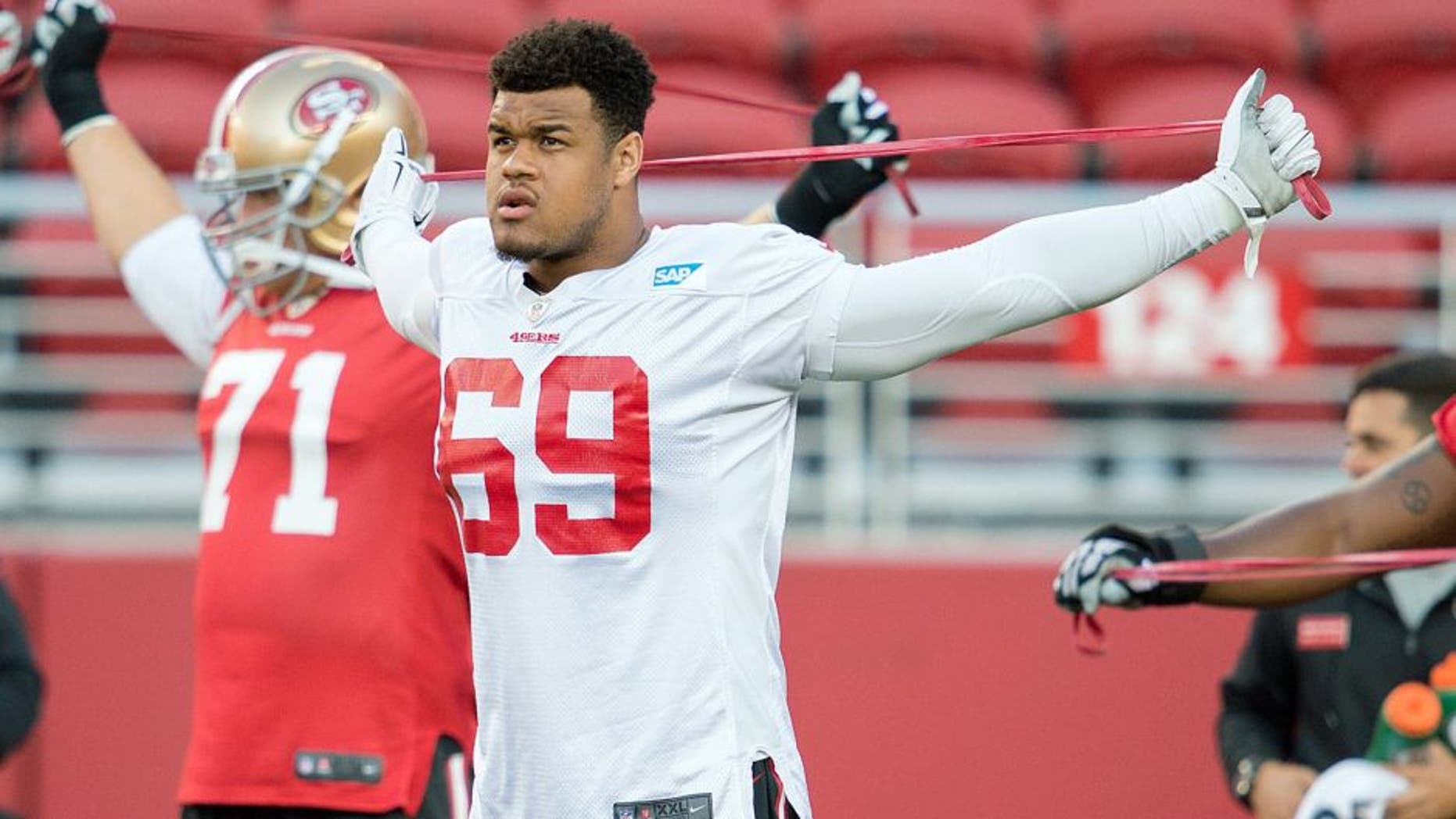 August 1, 2015; Santa Clara, CA, USA; San Francisco 49ers defensive lineman Arik Armstead (69) and guard Erik Pears (71) stretch during training camp at Levi's Stadium. Mandatory Credit: Kyle Terada-USA TODAY Sports
