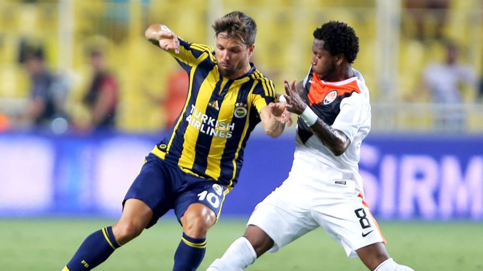 ISTANBUL, TURKEY - JULY 28: Fred of Shaktar Donetsk rides the ball past Fenerbahce's Souza during UEFA Champions League Third Qualifying Round 1st Leg match betweeen Fenerbahce v Shakhtar Donetsk at Sukru Saracoglu Stadium on July 28, 2015 in Istanbul, Turkey. (Photo by Burak Kara/Getty Images)