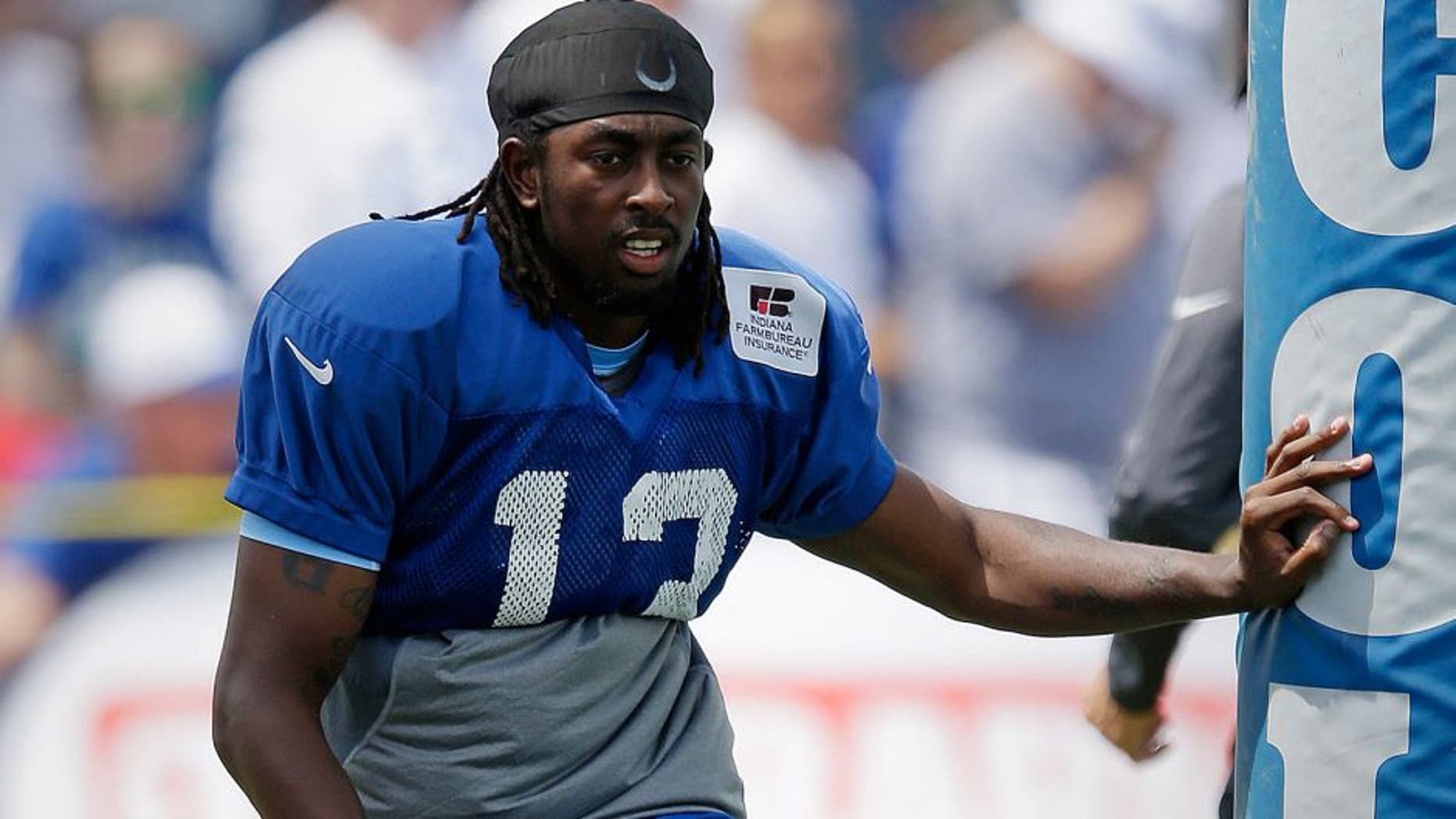 Indianapolis Colts wide receiver T.Y. Hilton (13) stretches during NFL football training camp in Anderson, Ind., Tuesday, Aug. 4, 2015. (AP Photo/Michael Conroy)