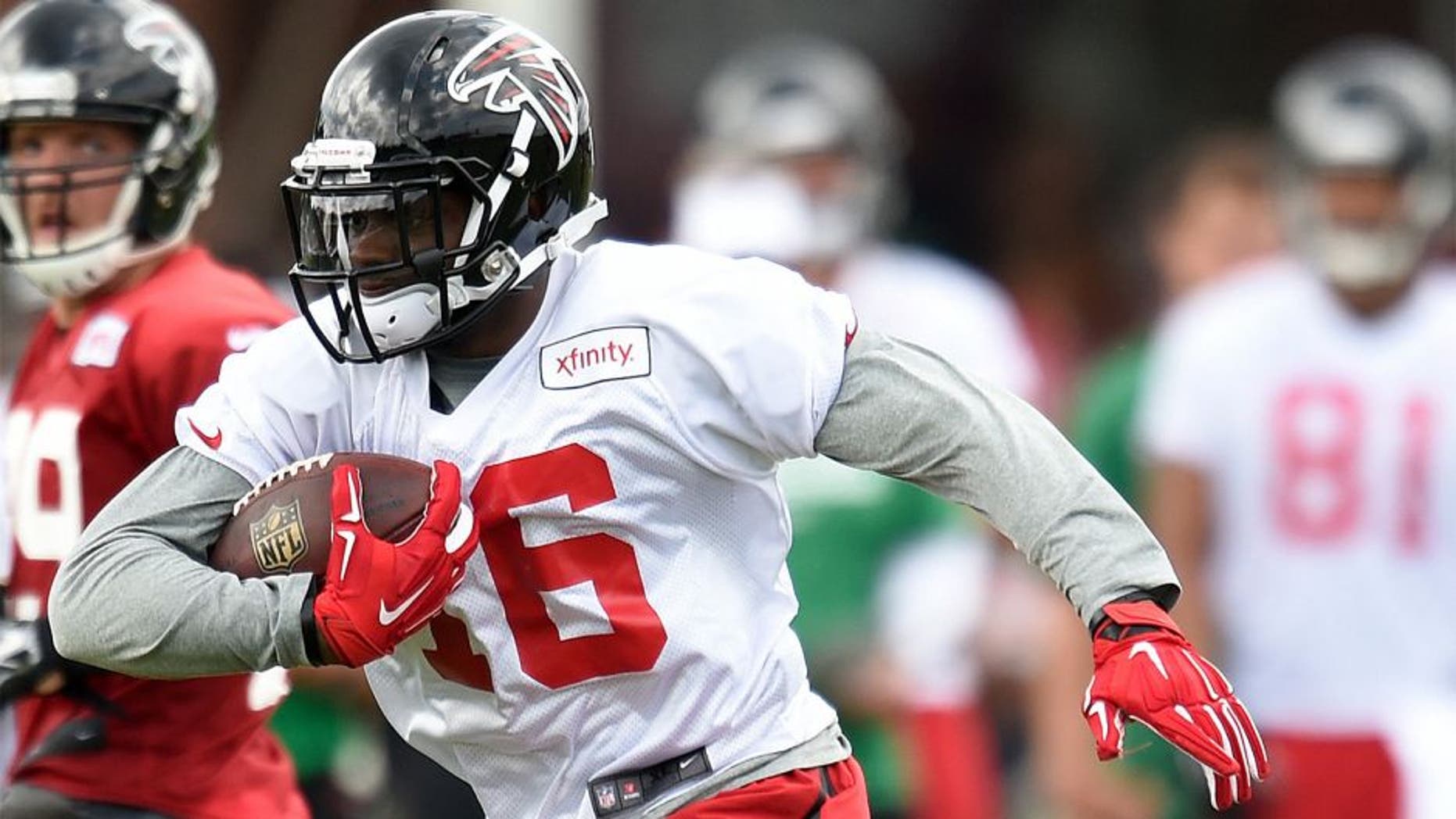 Aug 1, 2015; Atlanta, GA, USA; Atlanta Falcons wide receiver Justin Hardy (16) runs with the ball after a catch on the field during training camp at the Flowery Branch Training Facility. Mandatory Credit: Dale Zanine-USA TODAY Sports