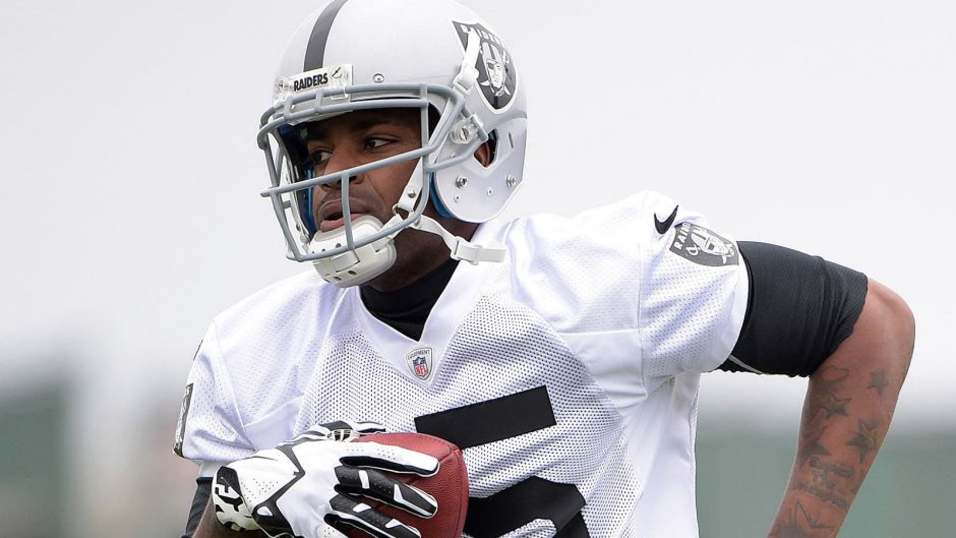 May 19, 2015; Alameda, CA, USA; Oakland Raiders receiver Michael Crabtree (15) at organized team activities at the Raiders practice facility. Mandatory Credit: Kirby Lee-USA TODAY Sports