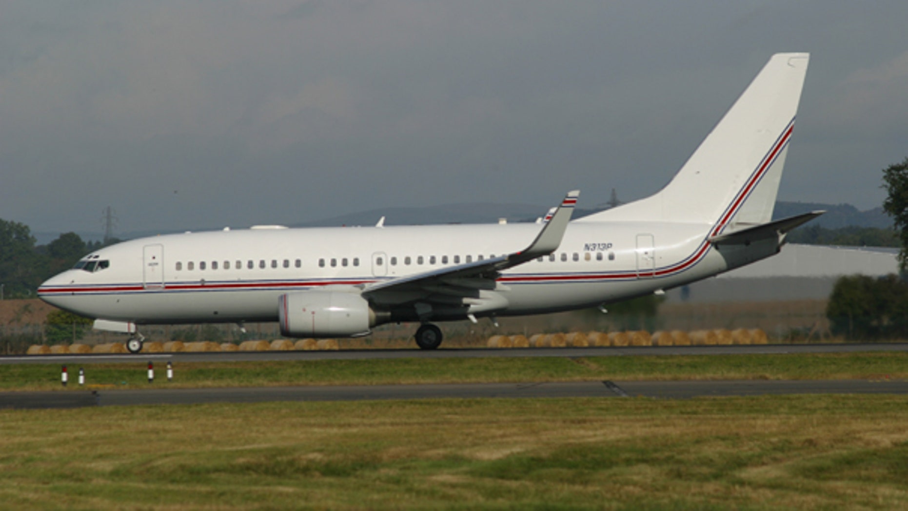 FILE: This Boeing 737, seen in Glasgow, Scotland on Sept. 7, 2003, has been identified by European investigators as a plane used for CIA rendition flights. Flight records and interviews with The Associated Press show the plane brought at least four high-value terrorists into Guantanamo Bay in 2003, years earlier than has been previously disclosed.