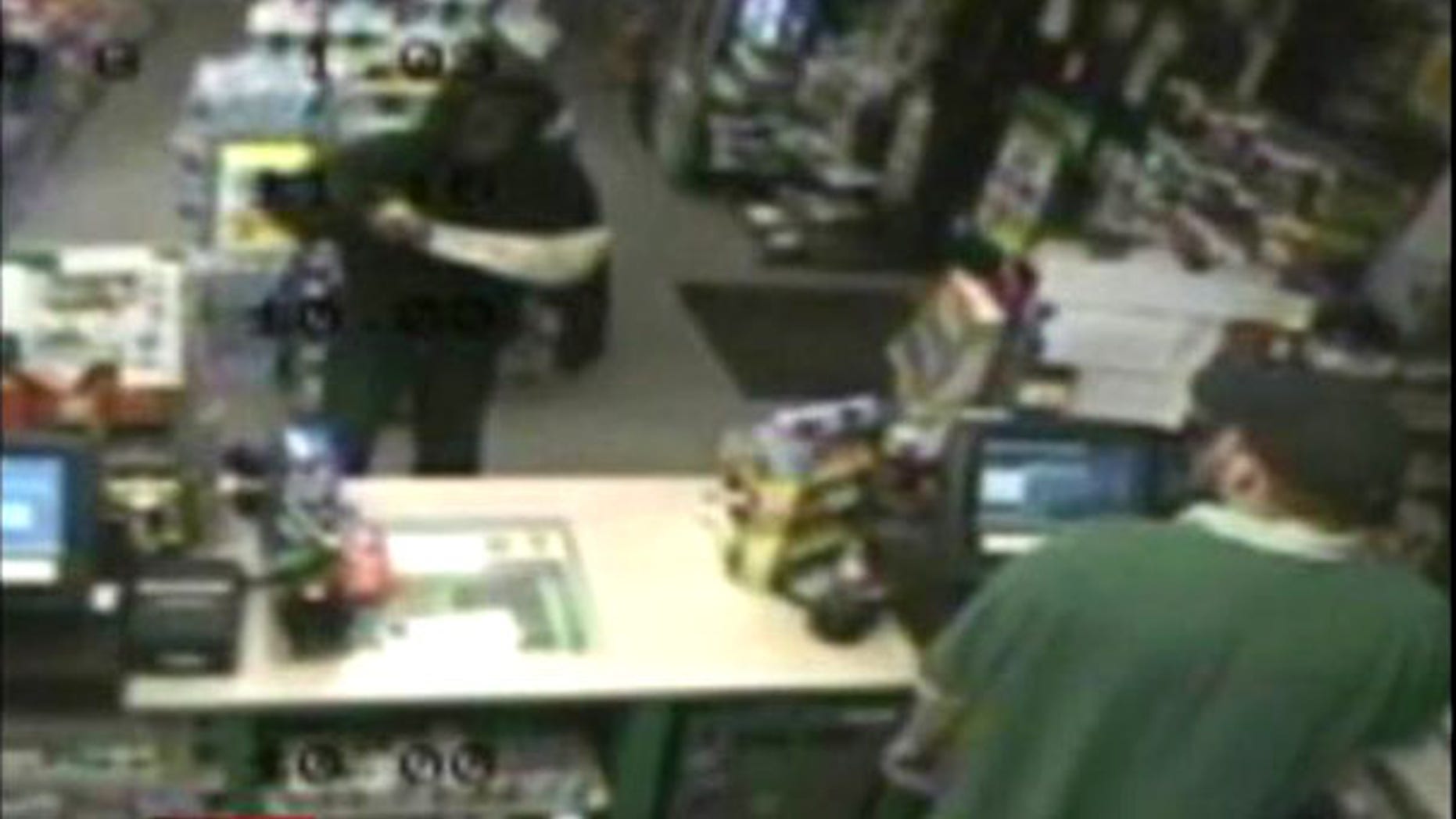 Aug. 3: An unidentified man wielding a machete is seen robbing a gas station in Raynham, Mass. Police suspect the thief also robbed a pizza delivery man with the massive blade.