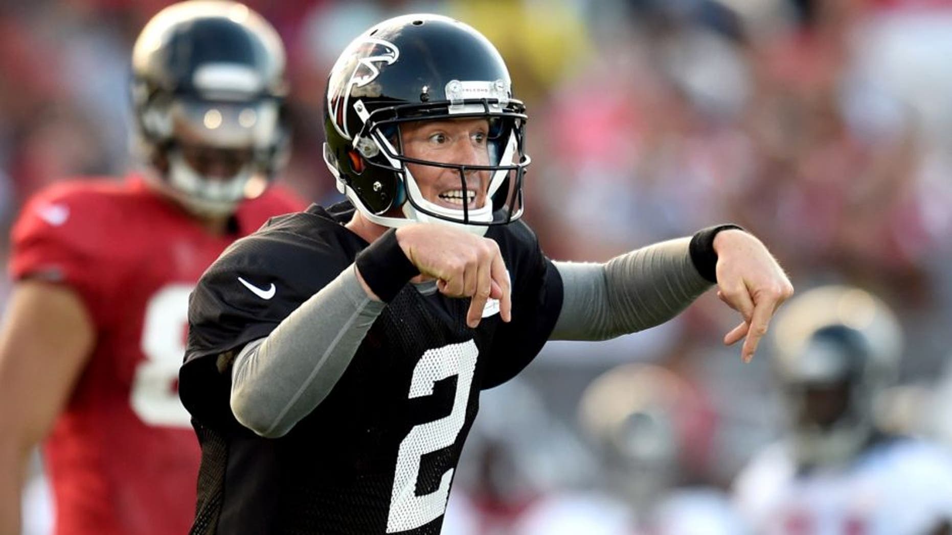Aug 1, 2014; Lawrenceville, GA, USA; Atlanta Falcons quarterback Matt Ryan (2) calls a play on the field during Atlanta Falcons practice during Falcons Friday Night Lights at Archer High School. Mandatory Credit: Dale Zanine-USA TODAY Sports