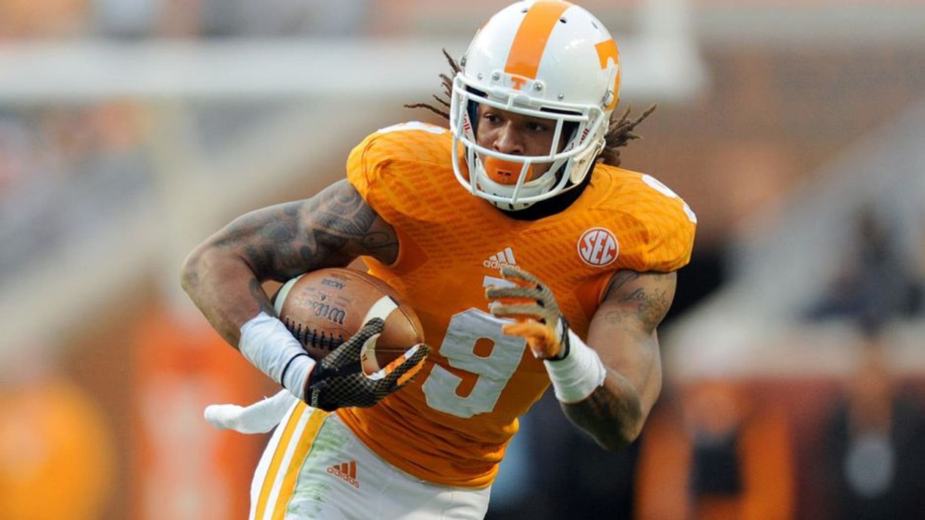 Nov 15, 2014; Knoxville, TN, USA; Tennessee Volunteers wide receiver Von Pearson (9) runs the ball against the Kentucky Wildcats during the first half at Neyland Stadium. Mandatory Credit: Randy Sartin-USA TODAY Sports