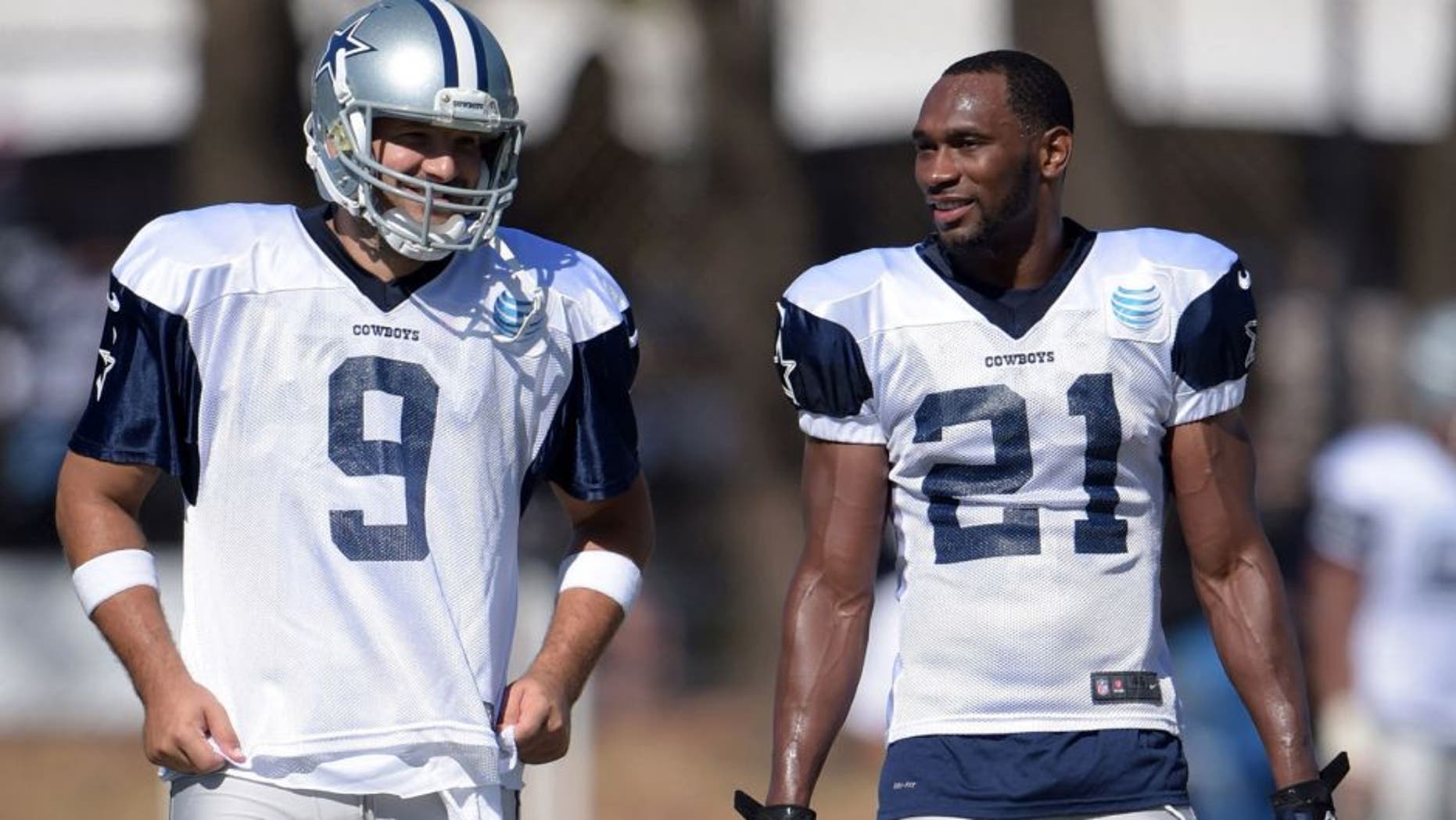 Aug 1, 2015; Oxnard, CA, USA; Dallas Cowboys quarterback Tony Romo (9) and running back Joseph Randle (21) at training camp at River Ridge Fields. Mandatory Credit: Kirby Lee-USA TODAY Sports