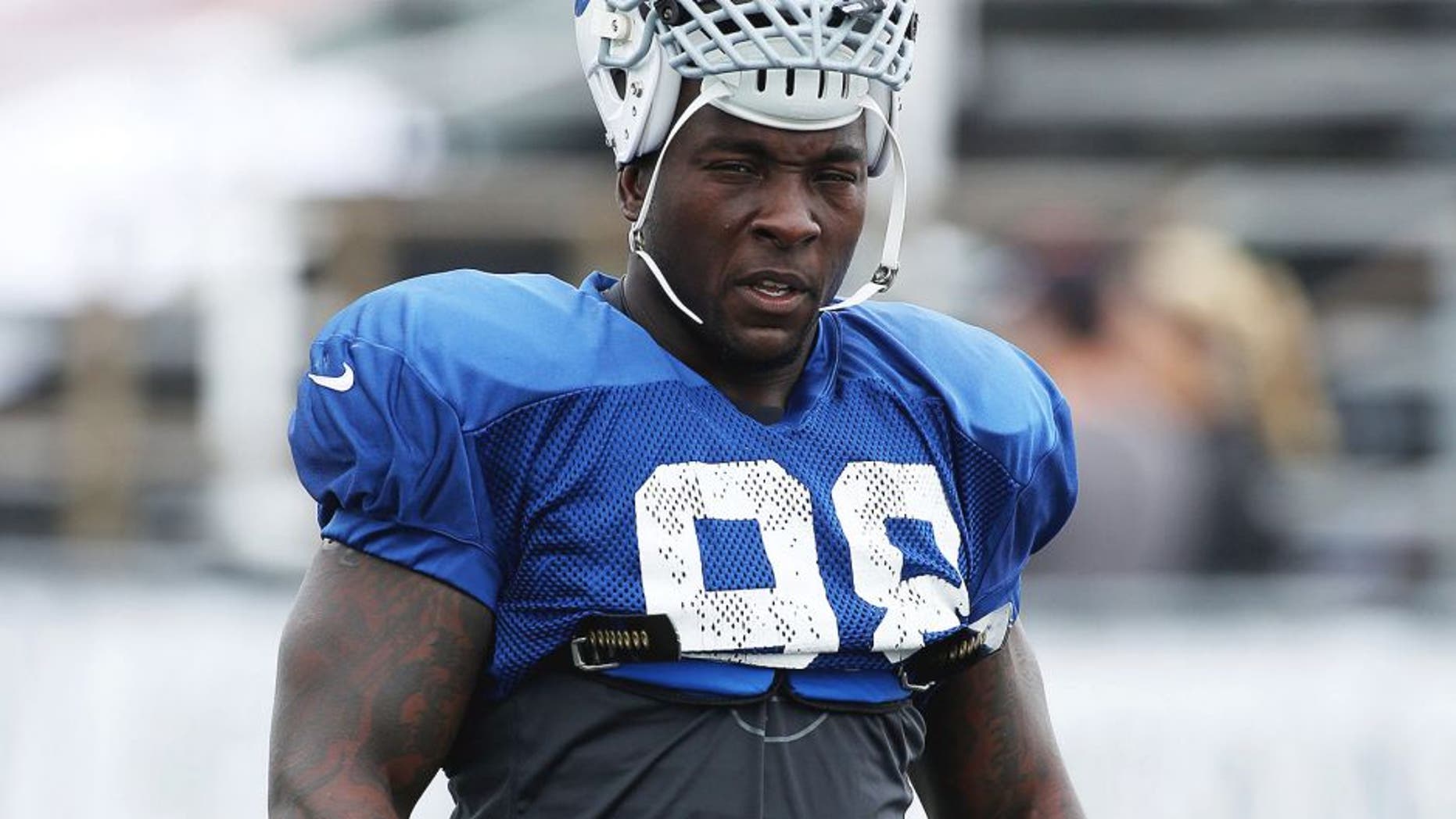Jul 31, 2013; Indianapolis, IN, USA; Indianapolis Colts linebacker Robert Mathis (98) walks across the field to head to his workout area during training camp at Anderson University. Mandatory Credit: Brian Spurlock-USA TODAY Sports