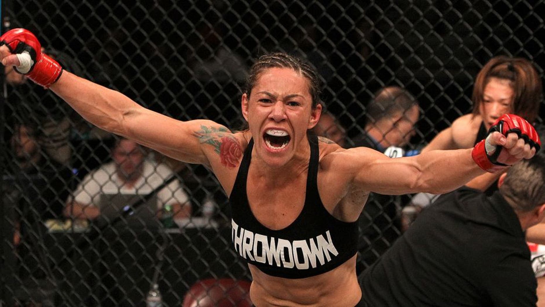 SAN DIEGO - DECEMBER 17: Cris "Cyborg" Santos reacts to her knockout victory over Hiroko Yamanaka during the Strikeforce event at the Valley View Casino Center on December 17, 2011 in San Diego, California. (Photo by Josh Hedges/Forza LLC/Forza LLC via Getty Images)