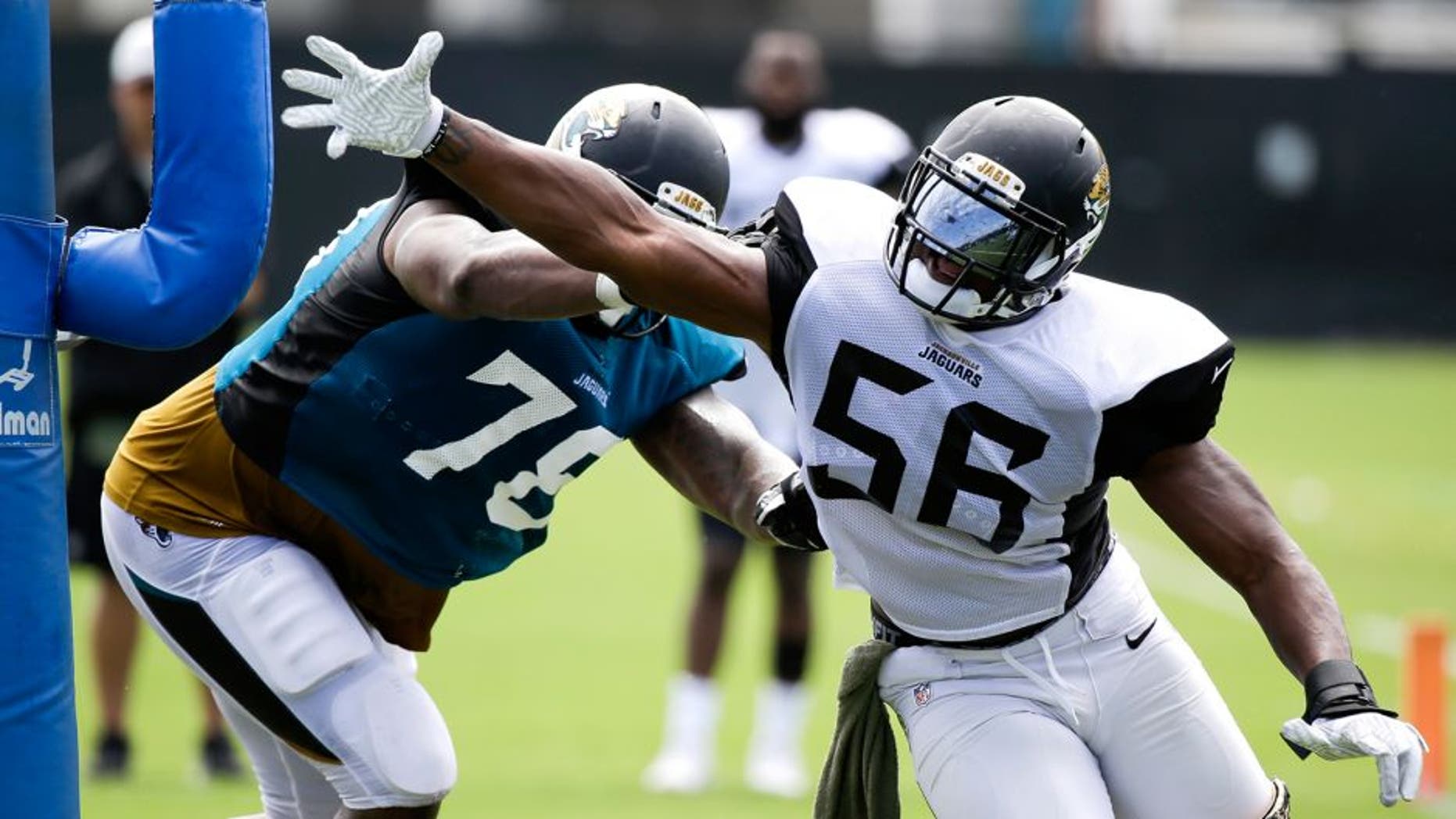 Jacksonville Jaguars defensive end Dante Fowler Jr., (56) works to get around offensive tackle Jermey Parnell (78) during a drill at NFL football training camp, Tuesday, Aug. 2, 2016, in Jacksonville, Fla. (AP Photo/John Raoux)