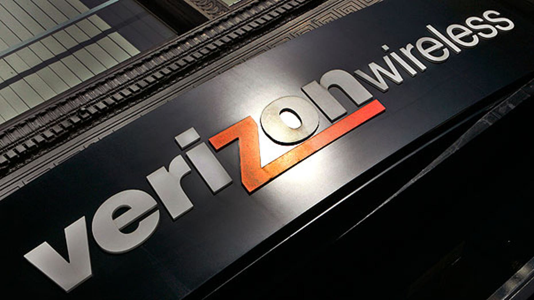 In this Oct. 30, 2006, file photo, a Verizon Wireless store sign is seen in a Portland, Ore.