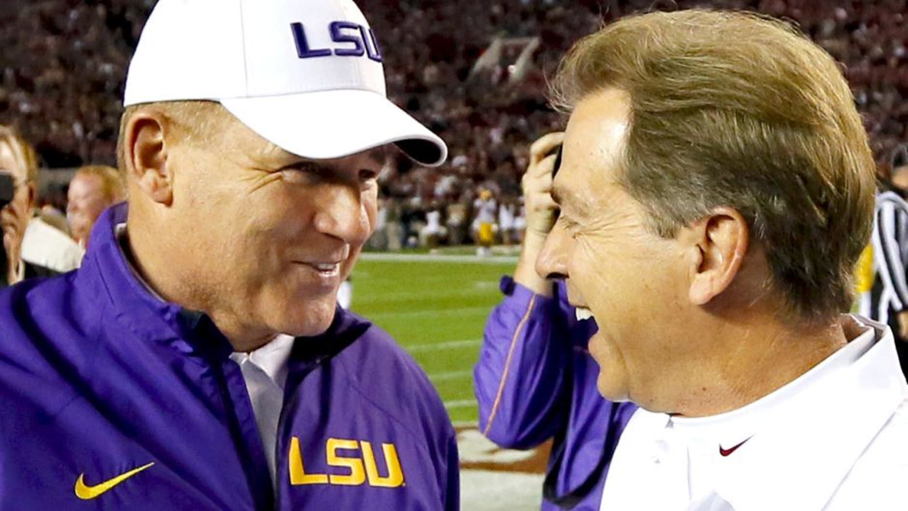 TUSCALOOSA, AL - NOVEMBER 09: (L-R) Head coach Les Miles of the LSU Tigers talks with head coach Nick Saban of the Alabama Crimson Tide before the game at Bryant-Denny Stadium on November 9, 2013 in Tuscaloosa, Alabama. (Photo by Kevin C. Cox/Getty Images)