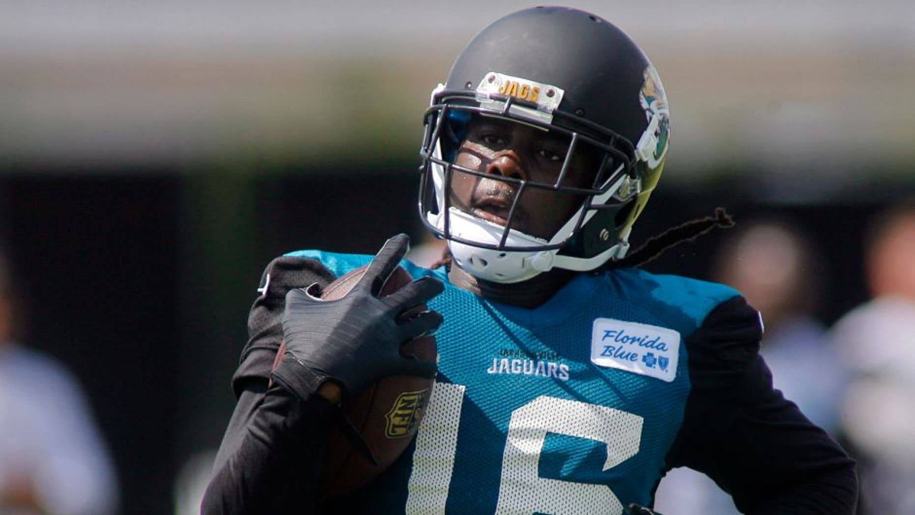 Jul 25, 2014; Jacksonville, FL, USA; Jacksonville Jaguars wide receiver Denard Robinson (16) runs with the ball during the first day of training camp at Florida Blue Health and Wellness Practice Fields. Mandatory Credit: Phil Sears-USA TODAY Sports