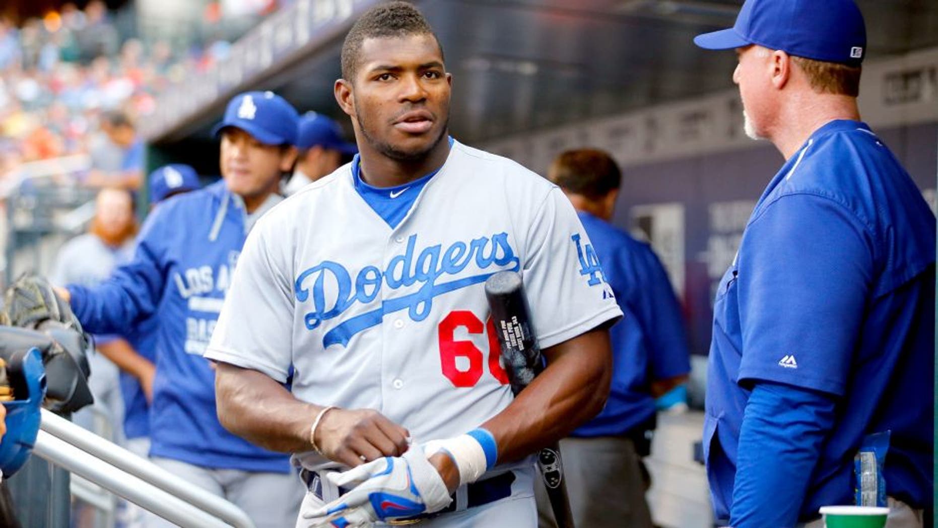 NEW YORK, NY - JULY 24: (NEW YORK DAILIES OUT) Yasiel Puig #66 of the Los Angeles Dodgers looks on against the New York Mets at Citi Field on July 24, 2015 in the Flushing neighborhood of the Queens borough of New York City. The Dodgers defeated the Mets 7-2. (Photo by Jim McIsaac/Getty Images)