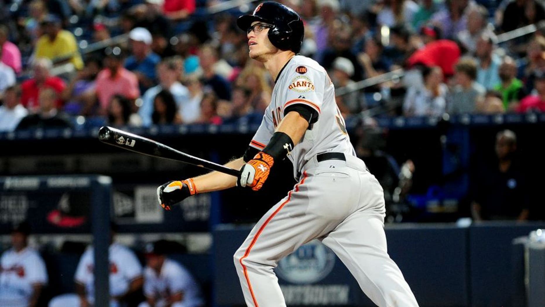 ATLANTA, GA - AUGUST 5: Kelby Tomlinson #37 of the San Francisco Giants knocks in a run with a fourth inning single against the Atlanta Braves at Turner Field on August 5, 2015 in Atlanta, Georgia. (Photo by Scott Cunningham/Getty Images)