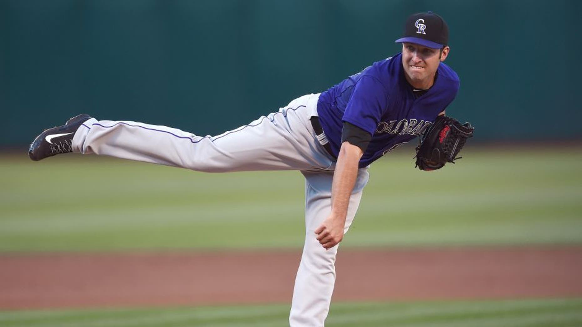 OAKLAND, CA - JUNE 29: David Hale #61 of the Colorado Rockies pitches against the Oakland Athletics in the bottom of the first inning at O.co Coliseum on June 29, 2015 in Oakland, California. (Photo by Thearon W. Henderson/Getty Images)