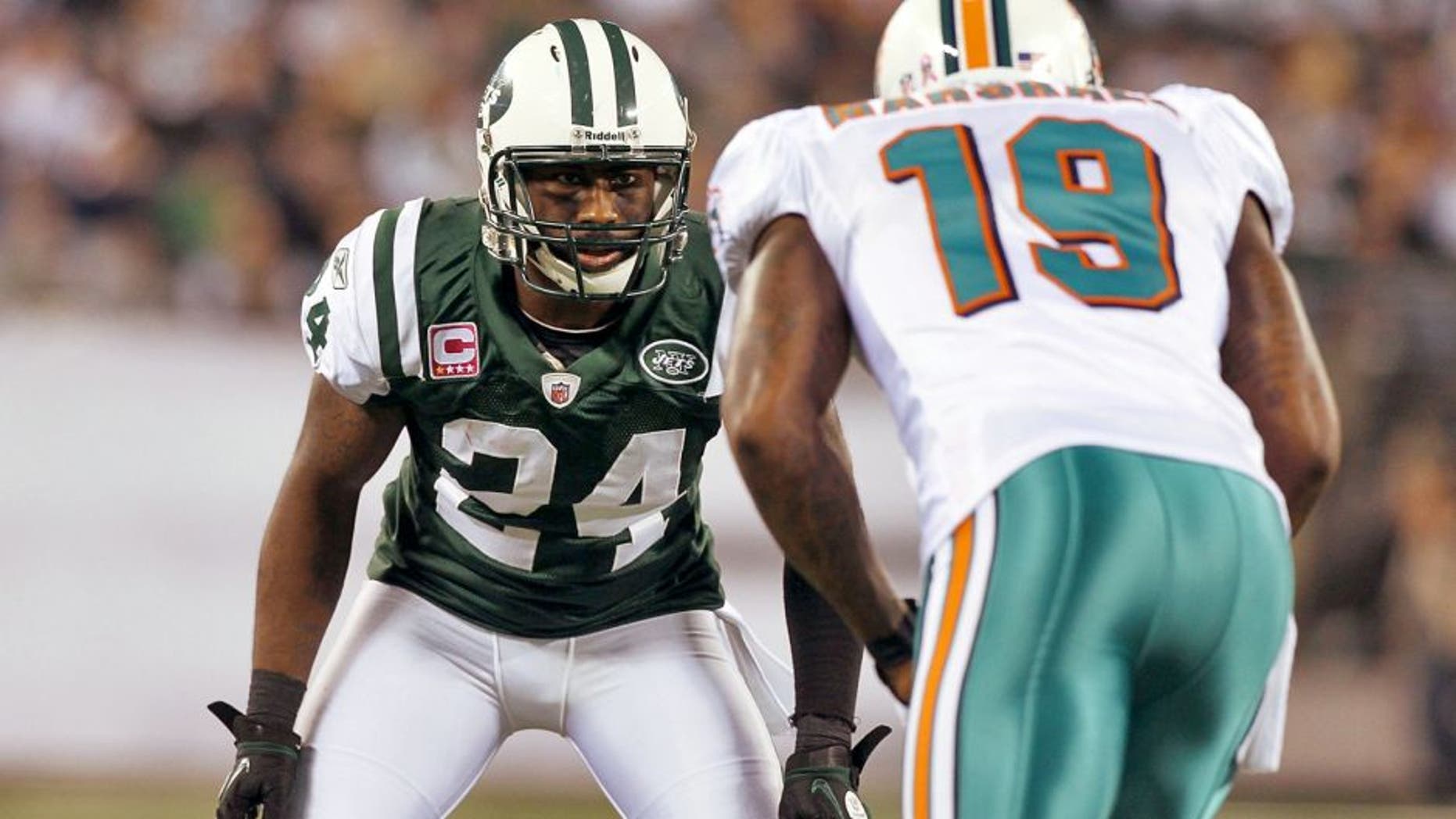 EAST RUTHERFORD, NJ - OCTOBER 17: (NEW YORK DAILIES OUT) Darrelle Revis #24 of the New York Jets defends against Brandon Marshall #19 of the Miami Dolphins on October 17, 2011 at MetLife Stadium in East Rutherford, New Jersey. The Jets defeated the Dolphins 24-6.. (Photo by Jim McIsaac/Getty Images)