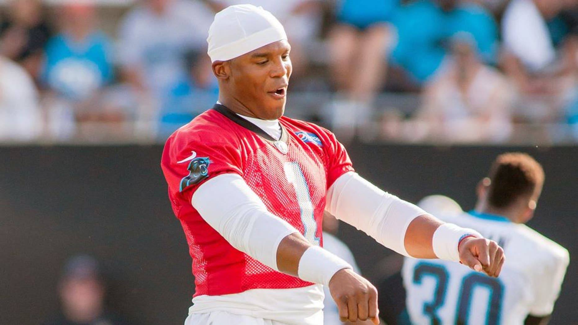 Jul 31, 2015; Spartanburg, SC, USA; Carolina Panthers quarterback Cam Newton (1) dances while stretching during training camp held at Wofford College. Mandatory Credit: Jeremy Brevard-USA TODAY Sports
