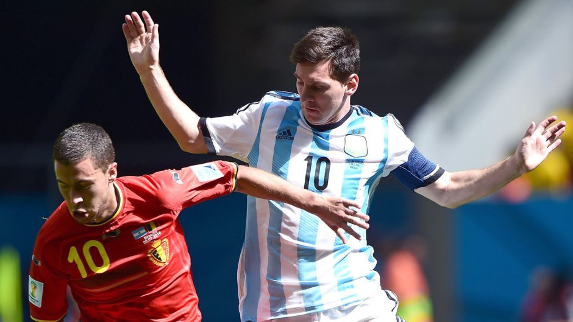 Belgium's midfielder Eden Hazard (L) vies with Argentina's forward Lionel Messi during the second half of a quarter-final football match between Argentina and Belgium at the Mane Garrincha National Stadium in Brasilia during the 2014 FIFA World Cup on July 5, 2014. AFP PHOTO / FRANCOIS XAVIER MARIT (Photo credit should read FRANCOIS XAVIER MARIT/AFP/Getty Images)