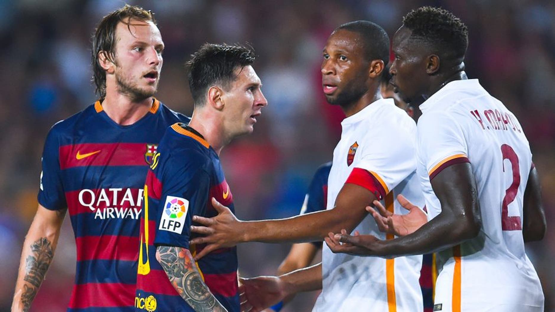 BARCELONA, SPAIN - AUGUST 05: Lionel Messi of FC Barcelona argues with Yanga-M'Biwa (R) of AS Romaduring the Joan Gamper trophy match at Camp Nou on August 5, 2015 in Barcelona, Spain. (Photo by David Ramos/Getty Images)
