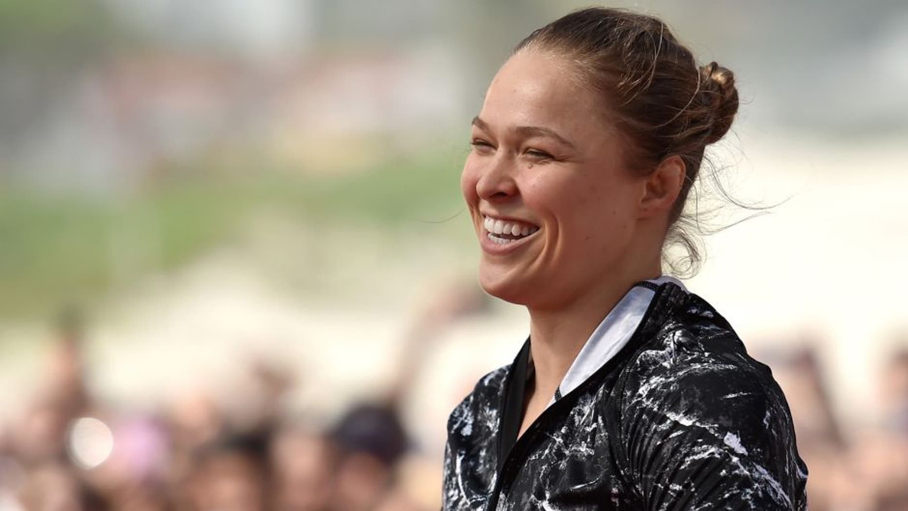 RIO DE JANEIRO, BRAZIL - JULY 29: Womens bantamweight champion Ronda Rousey of the United States smiles during open training session at Pepe Beach on July 29, 2015 in Rio de Janeiro, Brazil. (Photo by Buda Mendes/Zuffa LLC/Zuffa LLC via Getty Images)