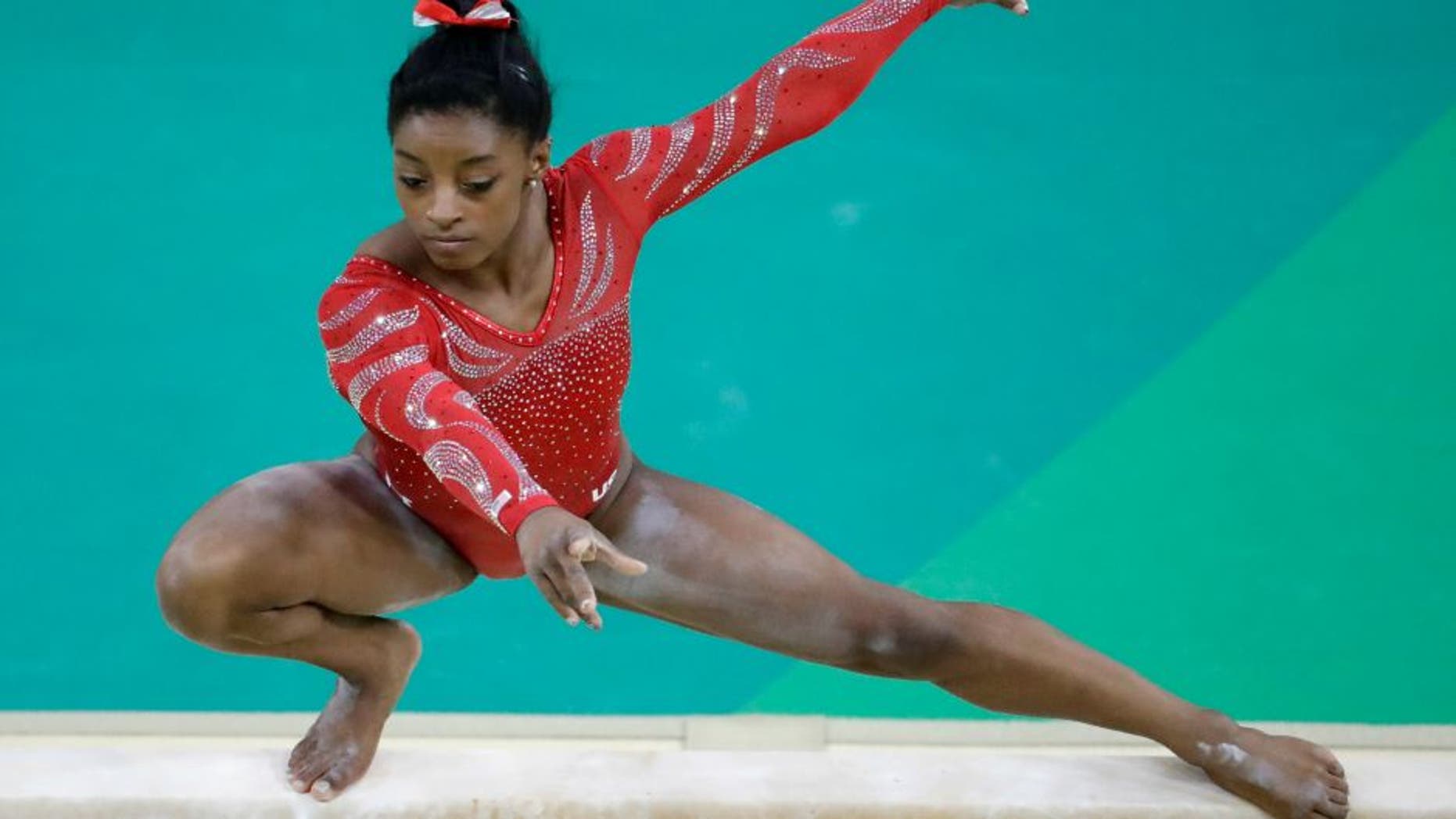 United States' Simone Biles trains on the balance beam ahead of the 2016 Summer Olympics in Rio de Janeiro, Brazil, Thursday, Aug. 4, 2016. (AP Photo/Julio Cortez)