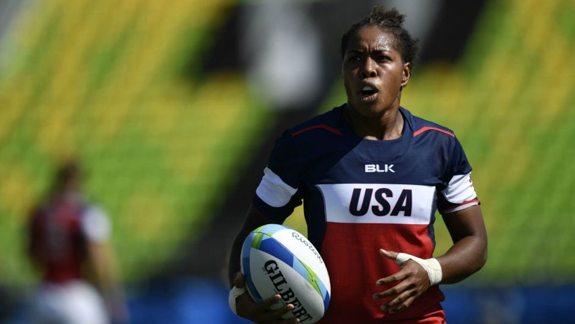 USA's Bui Baravilala prepares to take a kick in the womens rugby sevens match between Fiji and USA during the Rio 2016 Olympic Games at Deodoro Stadium in Rio de Janeiro on August 6, 2016. / AFP / PHILIPPE LOPEZ (Photo credit should read PHILIPPE LOPEZ/AFP/Getty Images)