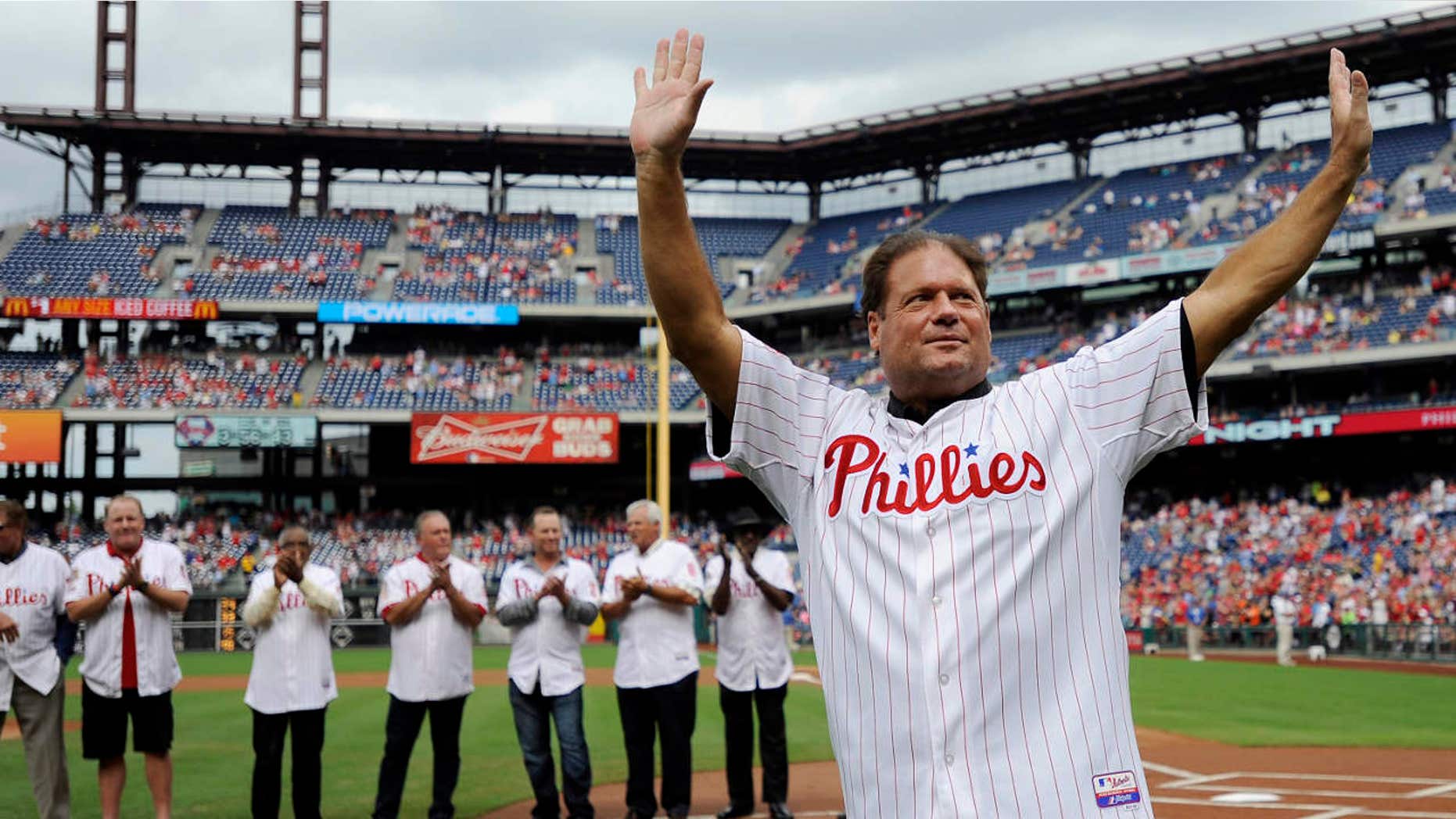 FILE- In this Aug 3, 2013, file photo, former Philadelphia Phillies catcher Darren Daulton waves to the crowd as he takes the field during the Philadelphia Phillies Alumni ceremonies before a baseball game against the Atlanta Braves in Philadelphia.