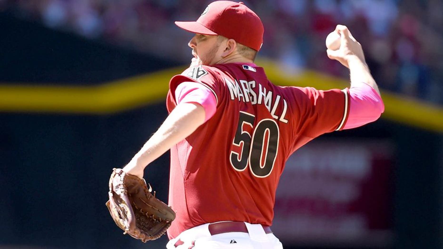 PHOENIX, AZ - MAY 10: Evan Marshall #50 of the Arizona Diamondbacks delivers a pitch against the San Diego Padres at Chase Field on May 10, 2015 in Phoenix, Arizona. (Photo by Norm Hall/Getty Images)