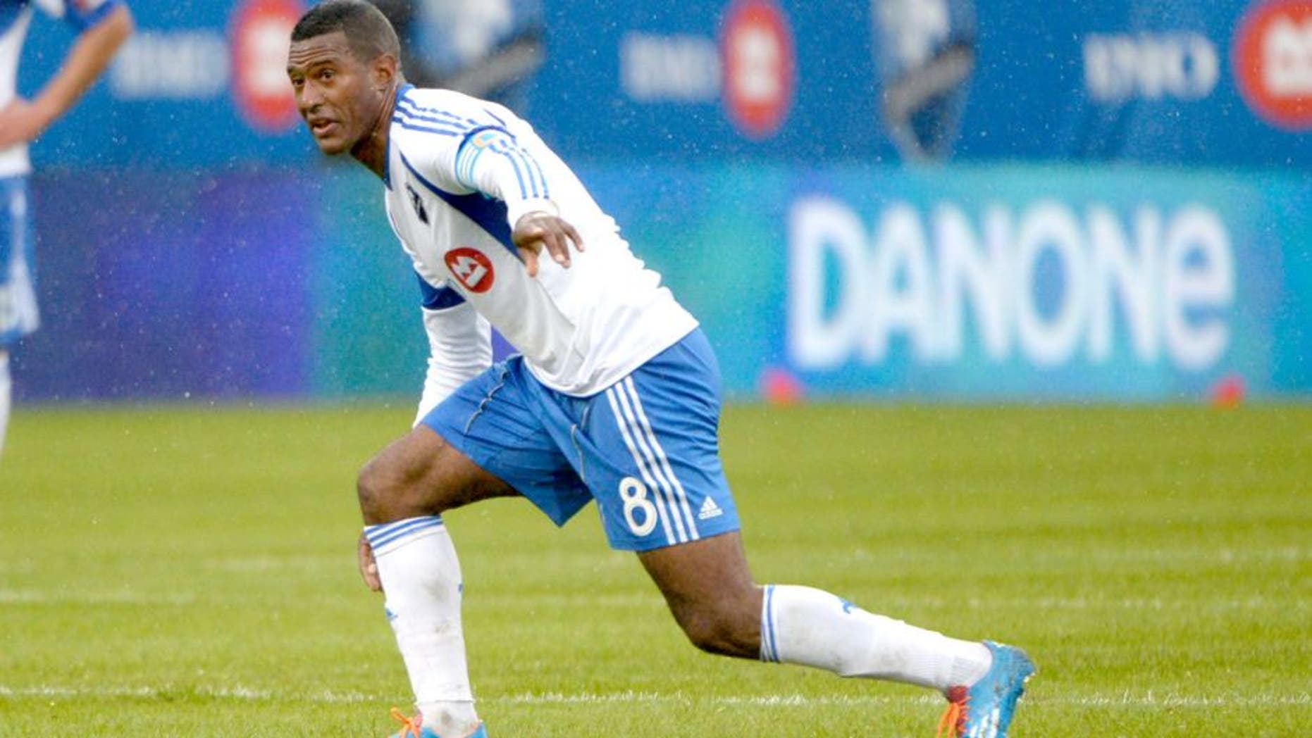Apr 26, 2014; Montreal, Quebec, Canada; Montreal Impact midfielder Patrice Bernier (8) directs teammates during the first half against the Philadelphia Union at Stade Saputo. Mandatory Credit: Eric Bolte-USA TODAY Sports