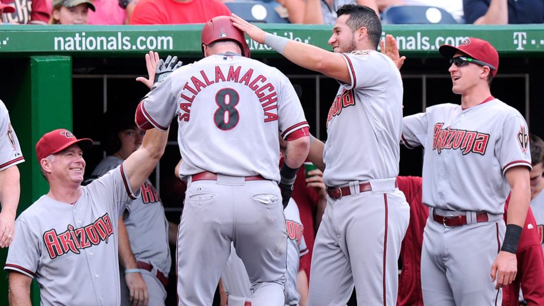 WASHINGTON, DC - AUGUST 06: Jarrod Saltalamacchia #8 of the Arizona Diamondbacks celebrates with teammates after hitting a home run in the fifth inning against the Washington Nationals at Nationals Park on August 6, 2015 in Washington, DC. (Photo by Greg Fiume/Getty Images)