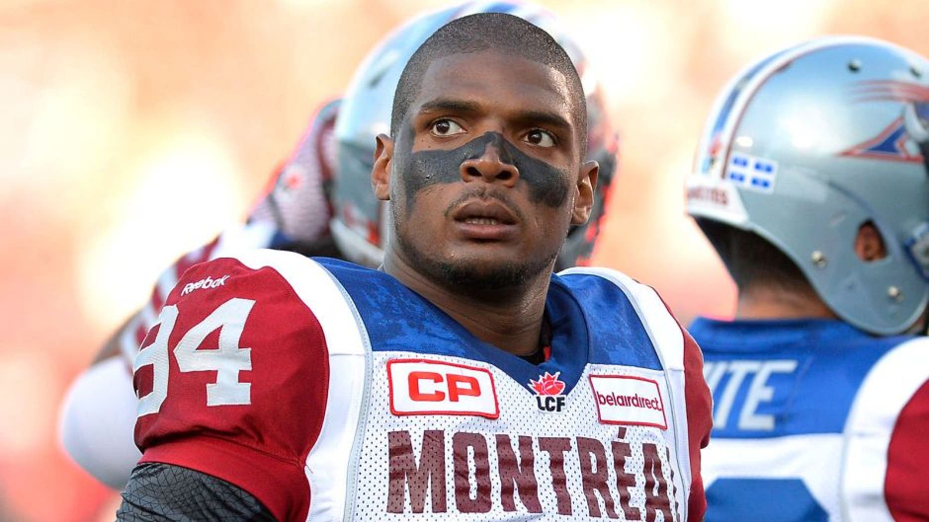 Montreal Alouettes' Michael Sam and teammates warm up for a Canadian Football League game against the Ottawa Redblacks in Ottawa, Ontario, on Friday, Aug. 7, 2015. (Justin Tang/The Canadian Press via AP)