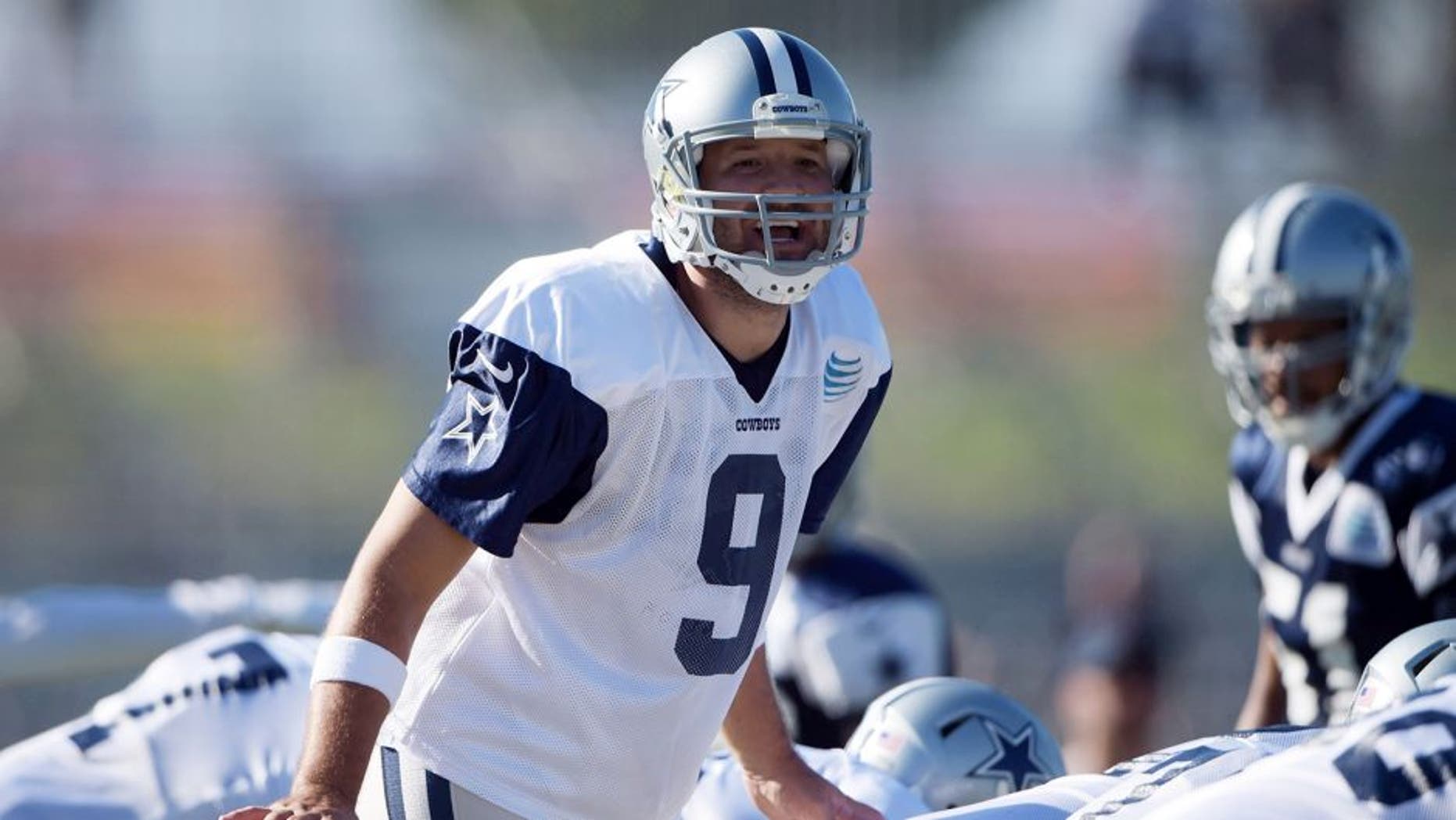 Aug 1, 2015; Oxnard, CA, USA; Dallas Cowboys quarterback Tony Romo (9) takes the snap at training camp at River Ridge Fields. Mandatory Credit: Kirby Lee-USA TODAY Sports