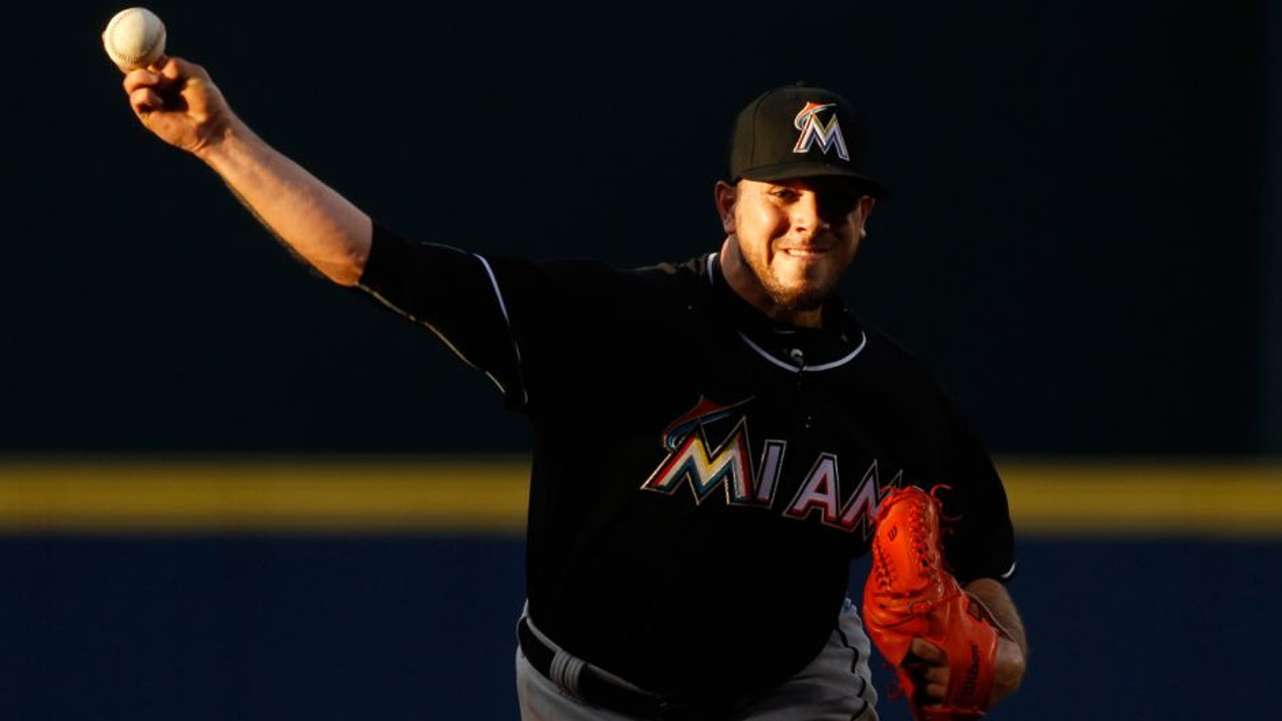 Miami Marlins starting pitcher Jose Fernandez throws during the first inning of the Marlins' baseball game against the Atlanta Braves, Friday, Aug. 7, 2015, in Atlanta. (AP Photo/Brett Davis)