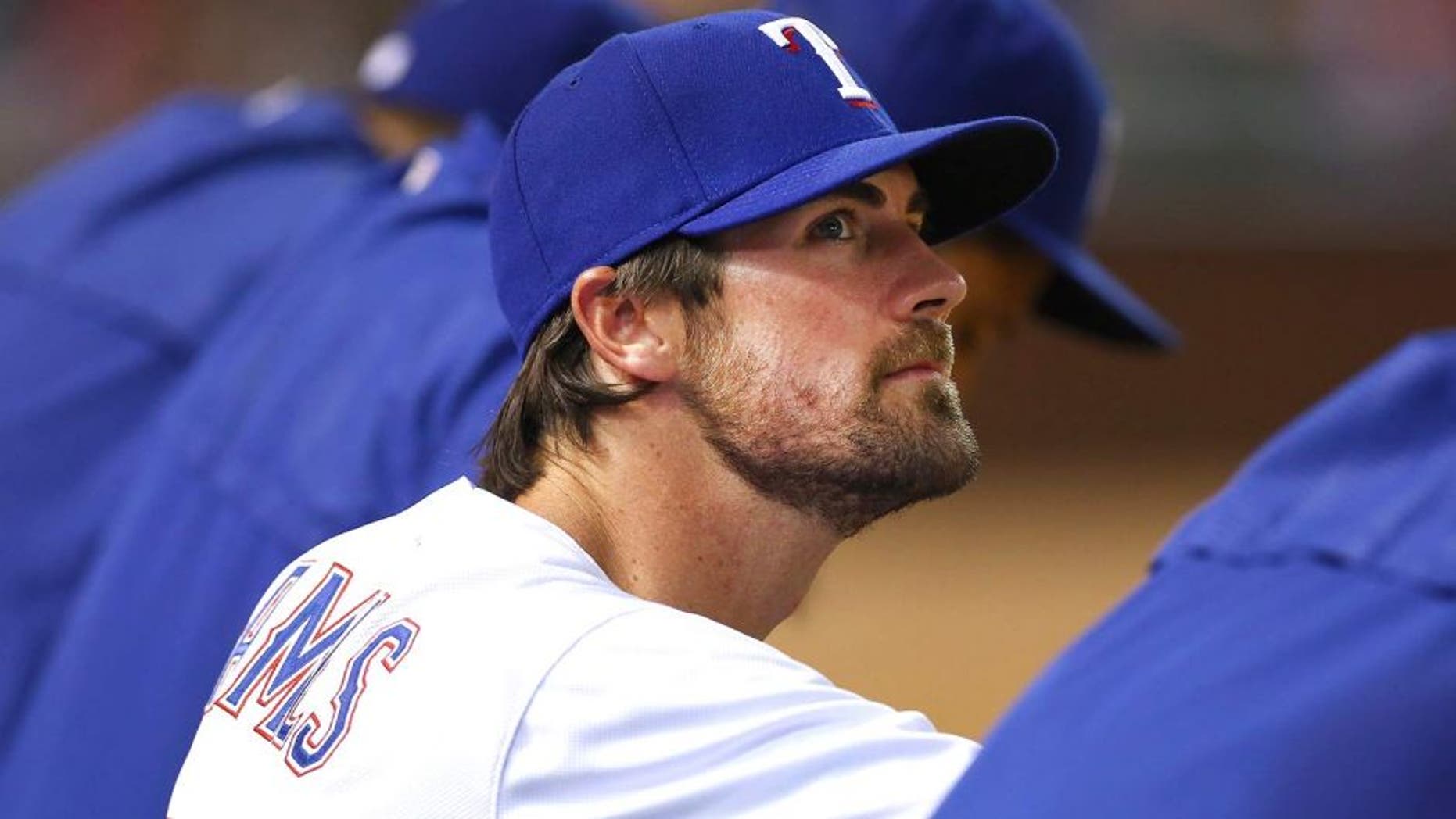 ARLINGTON, TX - JULY 31: Cole Hamels #35 of the Texas Rangers looks on as the Rangers take on the San Francisco Giants in the bottom of the eighth inning at Globe Life Park in Arlington on July 31, 2015 in Arlington, Texas. (Photo by Tom Pennington/Getty Images)