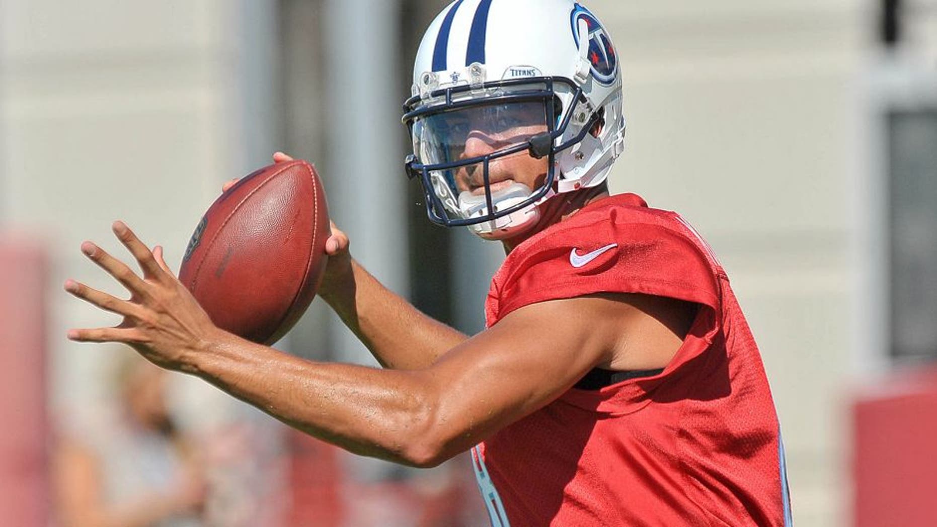 Jul 31, 2015; Nashville, TN, USA; Tennessee Titans quarterback Marcus Mariota (8) passes during his first day of training camp at Saint Thomas Sports Park. Mandatory Credit: Jim Brown-USA TODAY Sports