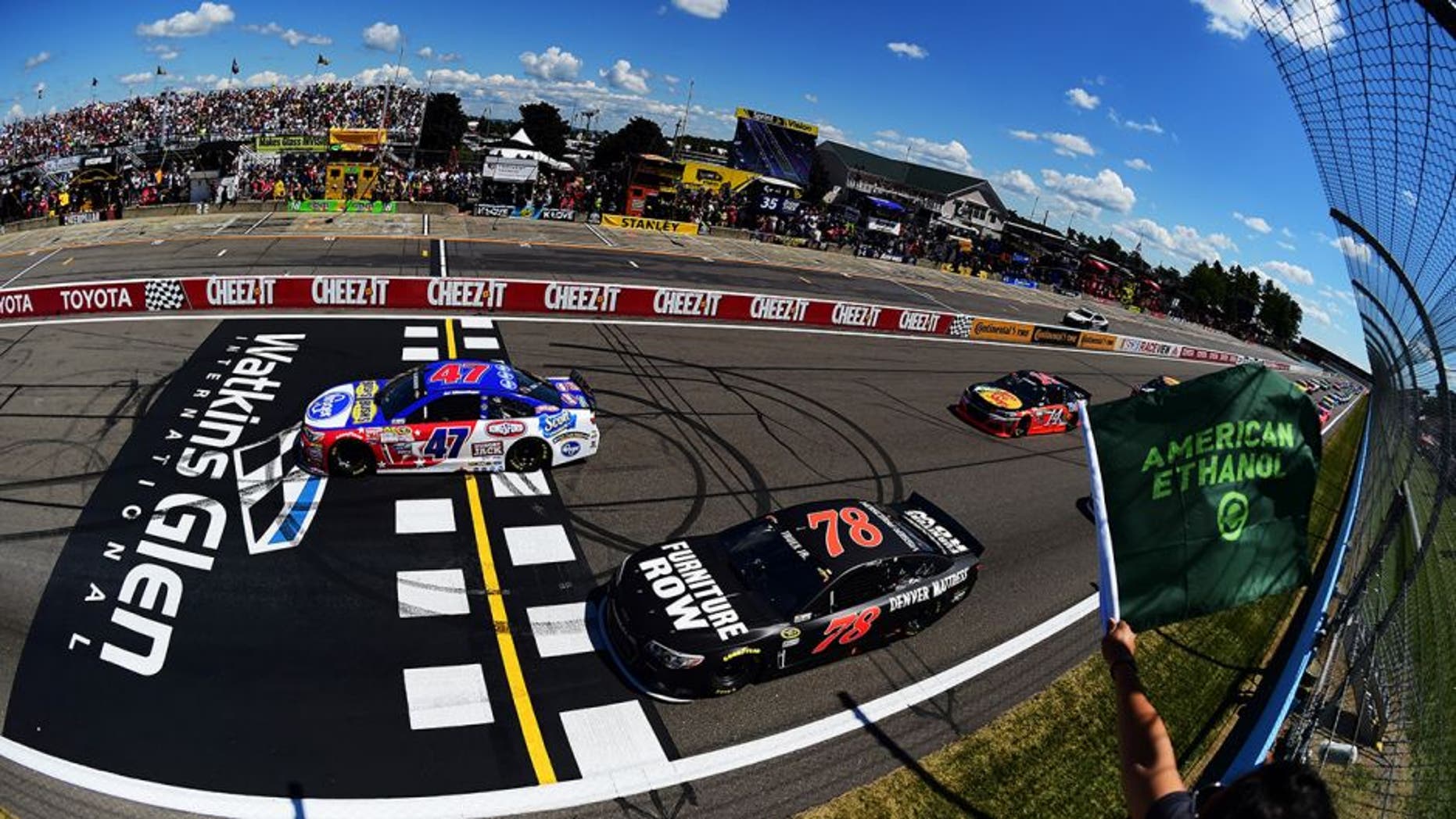WATKINS GLEN, NY - AUGUST 09: AJ Allmendinger, driver of the #47 Kroger/Bush's Beans Chevrolet, leads the field through the green flag to start the NASCAR Sprint Cup Series Cheez-It 355 at the Glen at Watkins Glen International on August 9, 2015 in Watkins Glen, New York. (Photo by Jared C. Tilton/NASCAR via Getty Images)