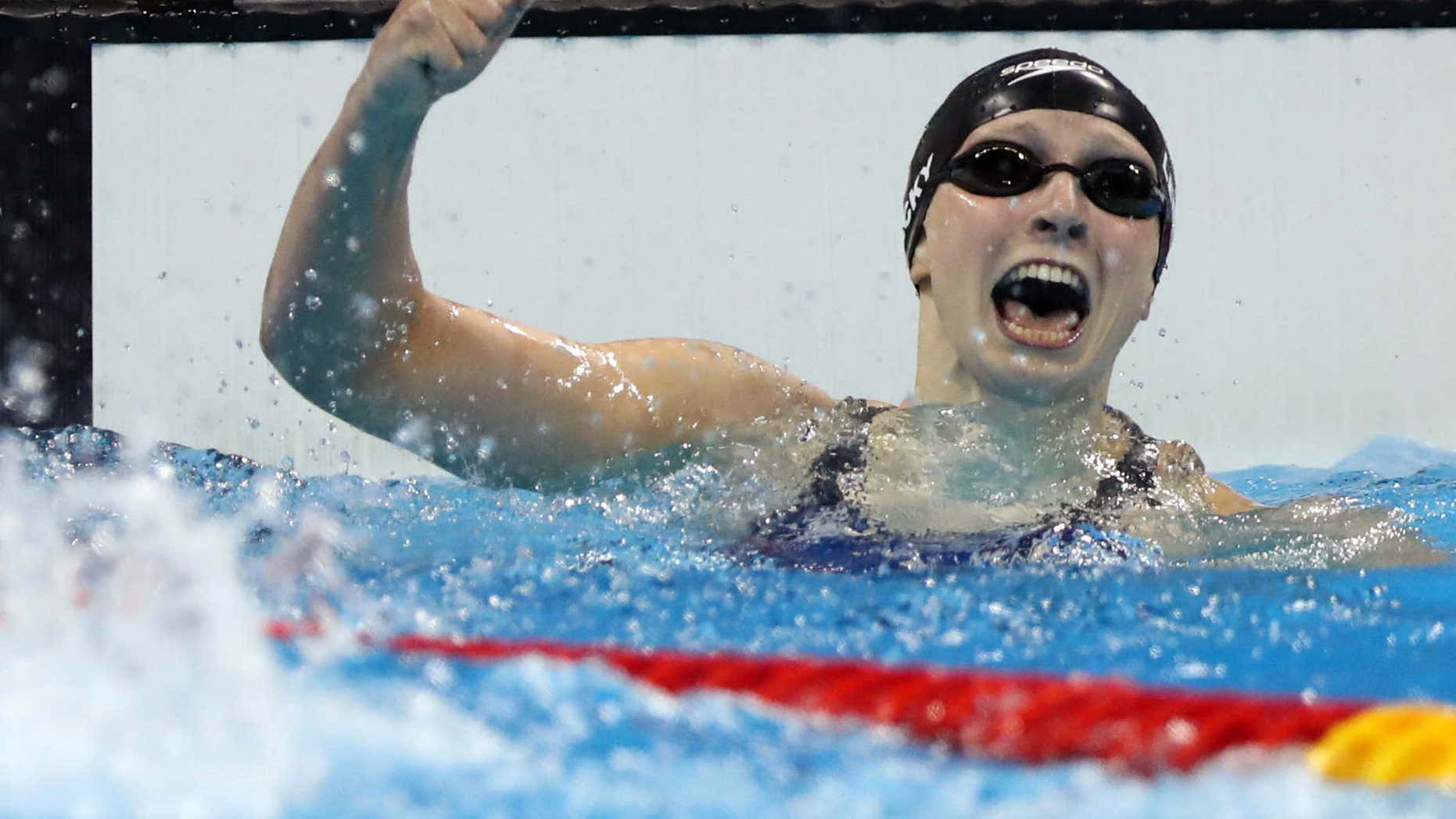 United States' Katie Ledecky celebrates winning the gold medal in the women's 400-meter freestyle setting a new world record during the swimming competitions at the 2016 Summer Olympics, Sunday, Aug. 7, 2016, in Rio de Janeiro, Brazil.