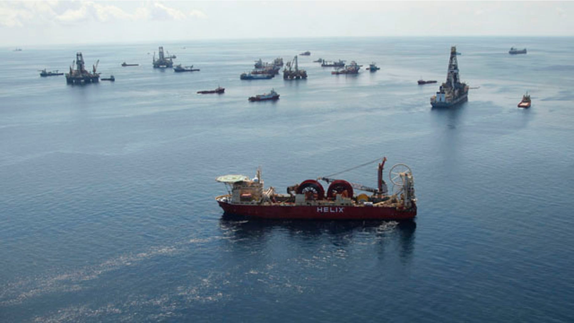Aug. 3: A support vessel, foreground center, and others surround the Helix Q4000, background center, used to perform the static kill operation, at the site of the Deepwater Horizon Oil Spill in the Gulf of Mexico, off the coast of Louisiana.