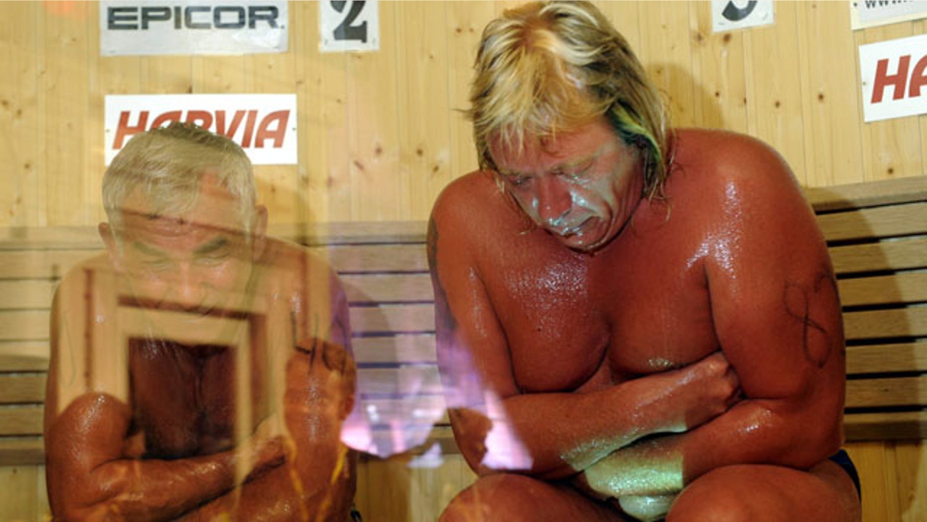Aug. 7: Russia's Vladimir Ladyzhenskiy, left, and Finland's Timo Kaukonen seen during the World Sauna Championships in Heinola, Finland.