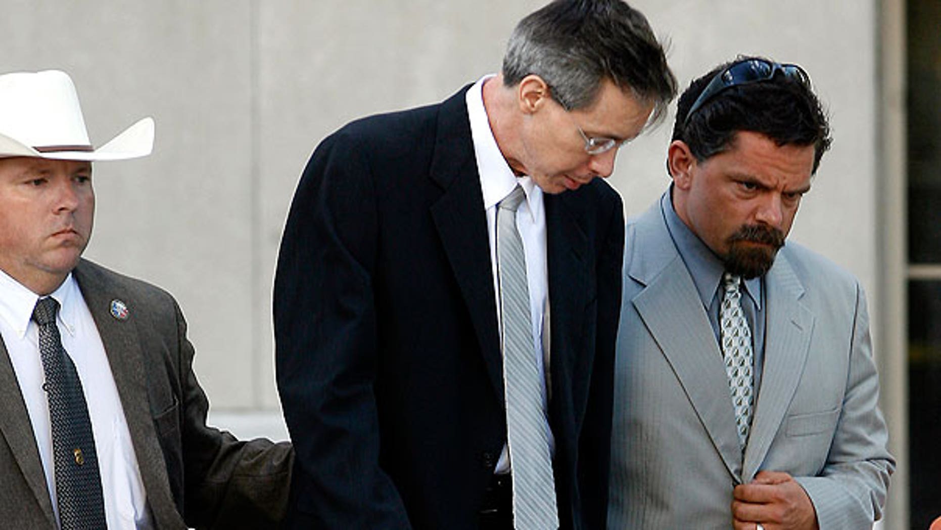 Aug. 4: Polygamist sect leader Warren Jeffs walks out of the Tom Green County Courthouse with his former attorney Deric Walpole in San Angelo, Texas.