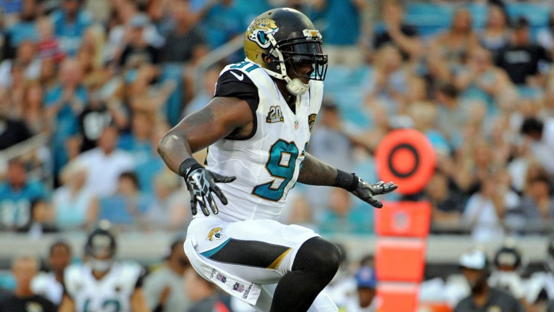 Aug 8, 2014; Jacksonville, FL, USA; Jacksonville Jaguars defensive end Chris Clemons (91) celebrates a sack during the first quarter of the game against the Tampa Bay Buccaneers at EverBank Field. Mandatory Credit: Melina Vastola-USA TODAY Sports