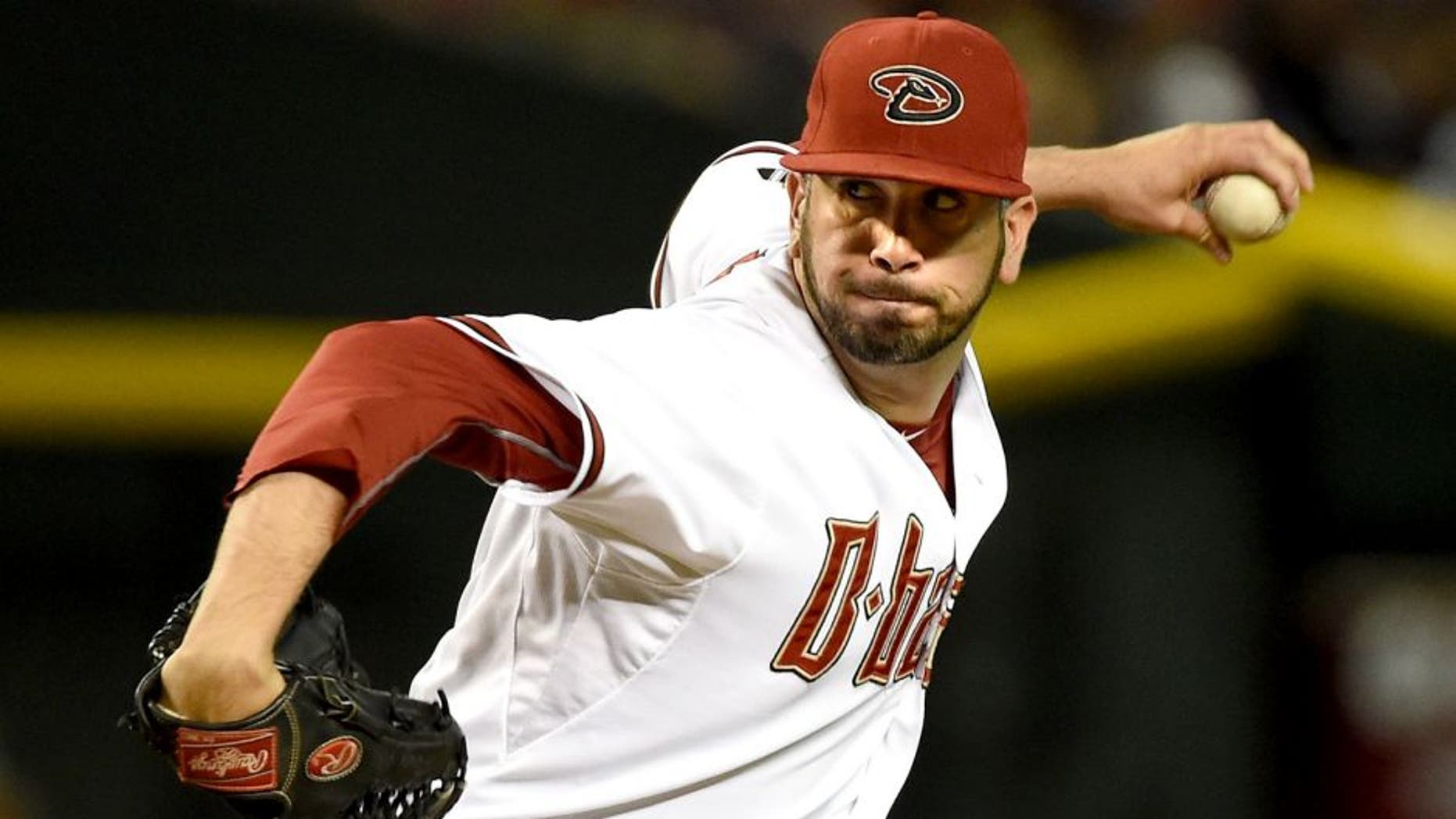 PHOENIX, AZ - JUNE 29: Oliver Perez #59 of the Arizona Diamondbacks delivers a pitch against the Los Angeles Dodgers at Chase Field on June 29, 2015 in Phoenix, Arizona. (Photo by Norm Hall/Getty Images)