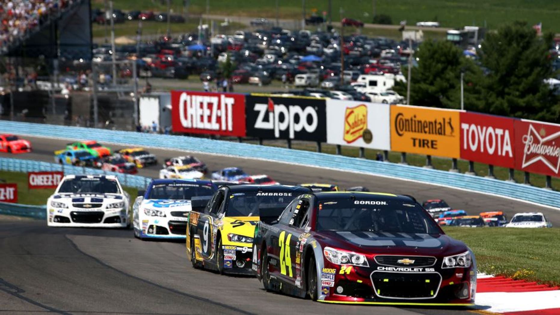 WATKINS GLEN, NY - AUGUST 10: Jeff Gordon, driver of the #24 Drive to End Hunger Chevrolet, leads a pack of cars during the NASCAR Sprint Cup Series Cheez-It 355 at Watkins Glen International on August 10, 2014 in Watkins Glen, New York. (Photo by Chris Graythen/NASCAR via Getty Images)