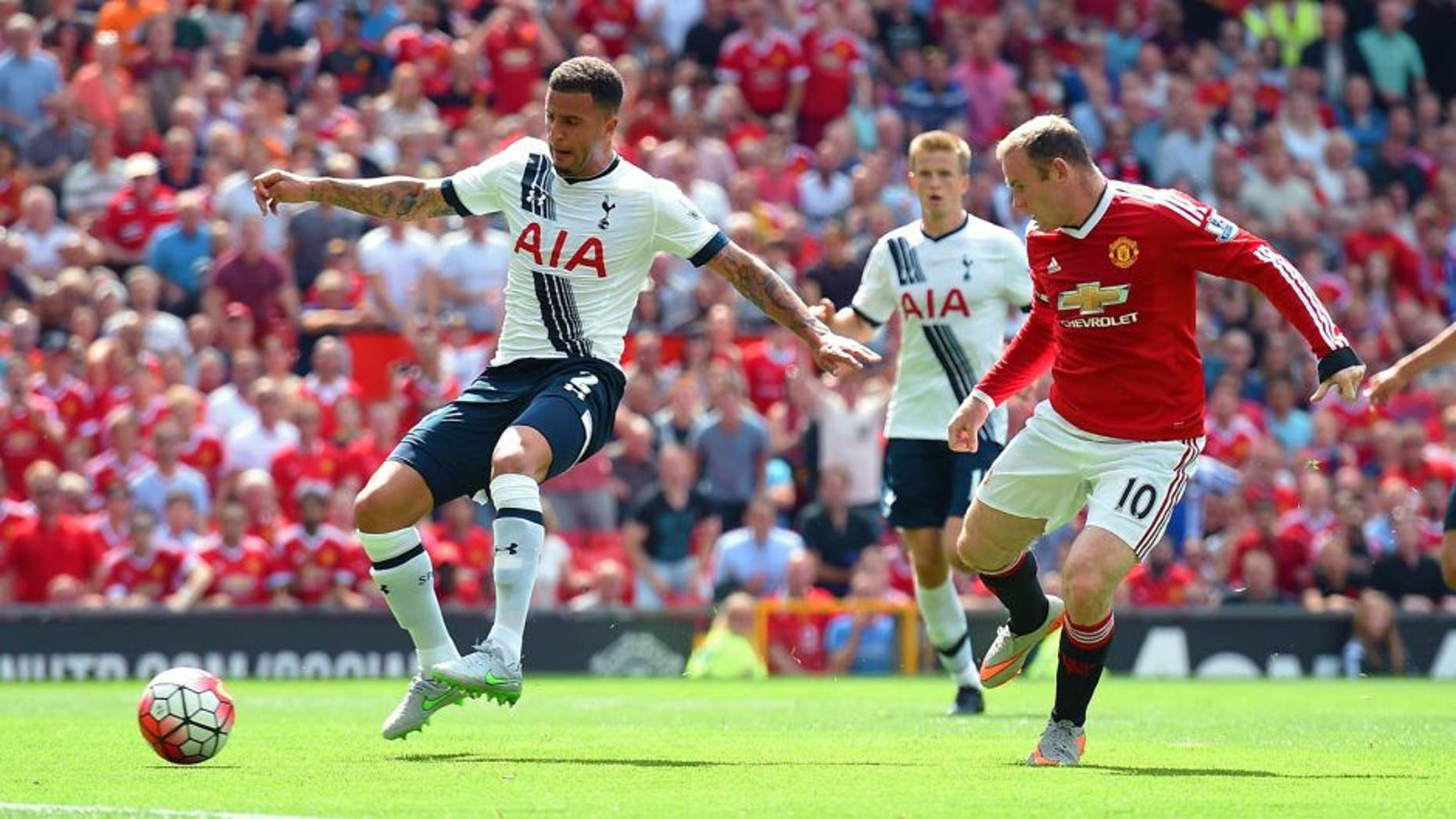 MANCHESTER, ENGLAND - AUGUST 08: Kyle Walker (L) of Tottenham Hotspur kicks the ball resulting in the own goal during the Barclays Premier League match between Manchester United and Tottenham Hotspur at Old Trafford on August 8, 2015 in Manchester, England. (Photo by Michael Regan/Getty Images)