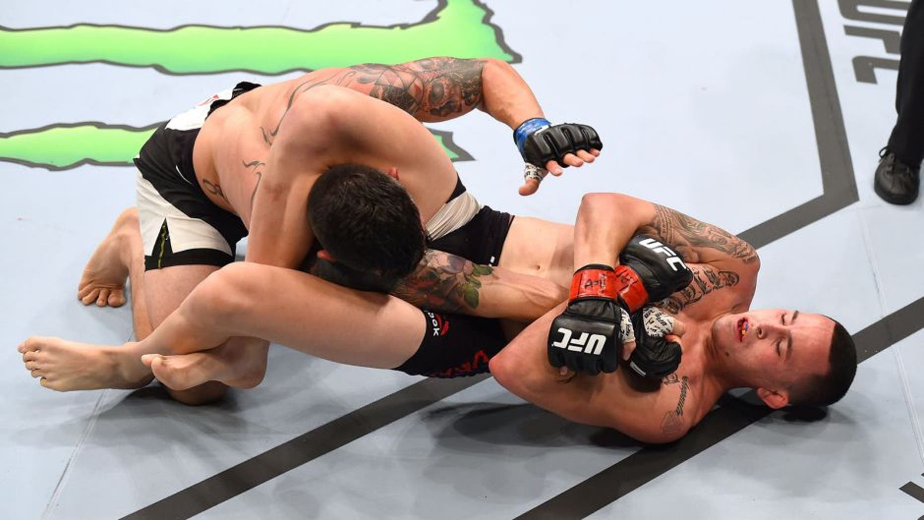 NASHVILLE, TN - AUGUST 08: (R-L) Marlon Vera of Ecuador attempts a submission against Roman Salazar in their bantamweight bout during the UFC Fight Night event at Bridgestone Arena on August 8, 2015 in Nashville, Tennessee. (Photo by Josh Hedges/Zuffa LLC/Zuffa LLC via Getty Images)