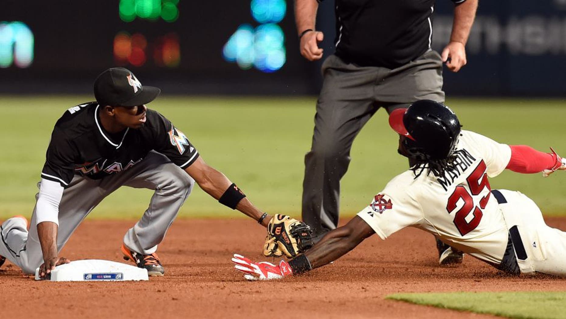 Aug 8, 2015; Atlanta, GA, USA; Atlanta Braves center fielder Cameron Maybin (25) is safe at second base during the fifth inning at Turner Field. Mandatory Credit: Dale Zanine-USA TODAY Sports
