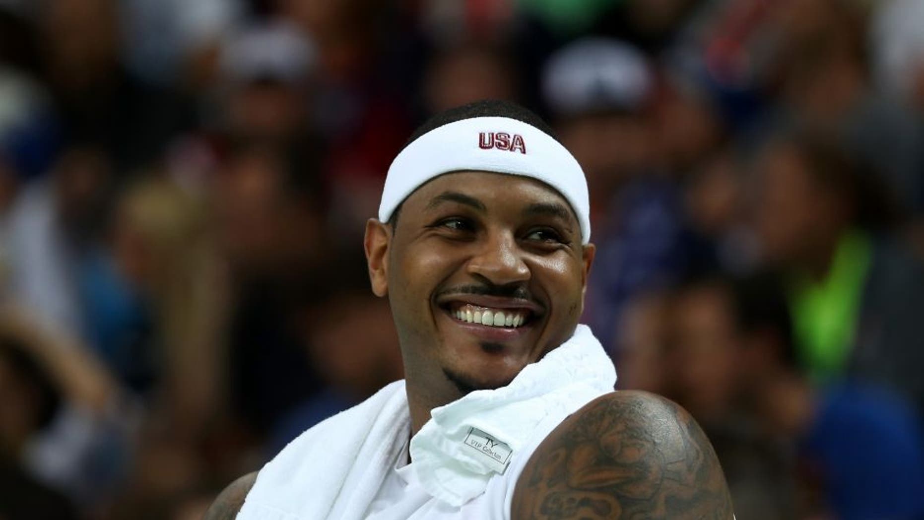 RIO DE JANEIRO, BRAZIL - AUGUST 08: Carmelo Anthony #15 of United States reacts on the bench during the game agaisnt Venezuela in the men's preliminary round group A game 19 on Day 3 of the Rio 2016 Olympic Games at the Carioca Arena 1 on August 8, 2016 in Rio de Janeiro, Brazil. (Photo by Bryn Lennon/Getty Images)