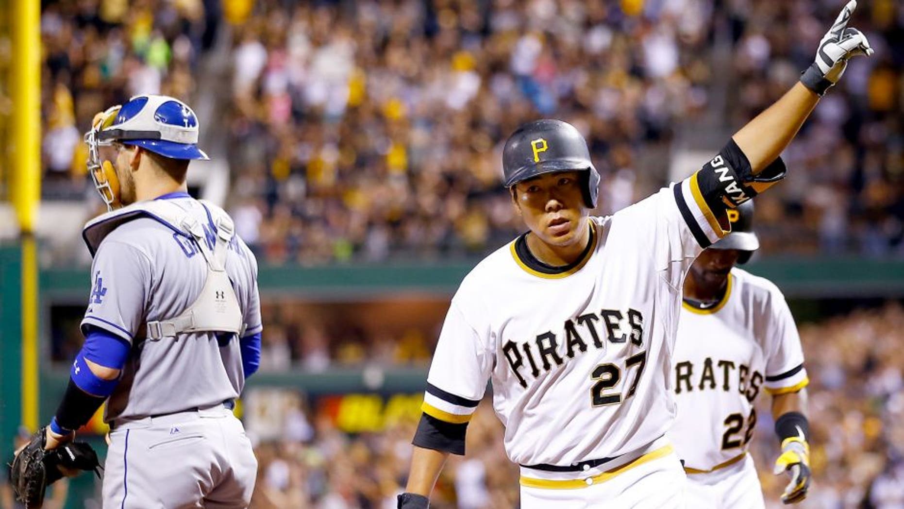 PITTSBURGH, PA - AUGUST 09: Jung Ho Kang #27 of the Pittsburgh Pirates celebrates his three run home run in the 7th inning against the Los Angeles Dodgers during the game at PNC Park on August 9, 2015 in Pittsburgh, Pennsylvania. (Photo by Jared Wickerham/Getty Images)